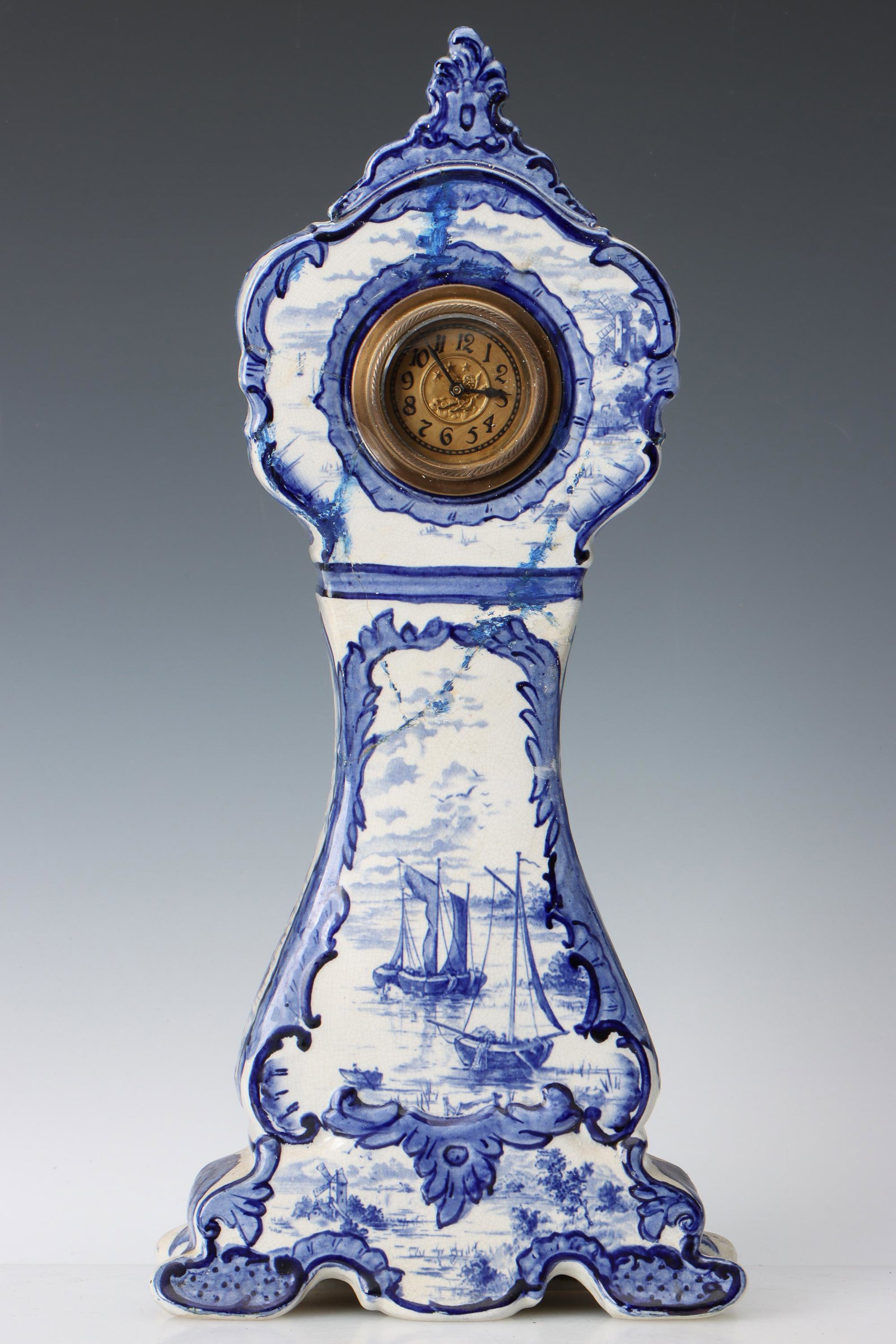 Antique Delft Miniature Tallcase Clock: Antique Delft Miniature Tallcase Clock. Tin glazed earthenware. Size: 16'' x 7.5'' x 3'' (41 x 19 x 8 cm). Exhibition and Post-Auction Pickup Location: Material Culture, 4700 Wissahickon Ave., Philade