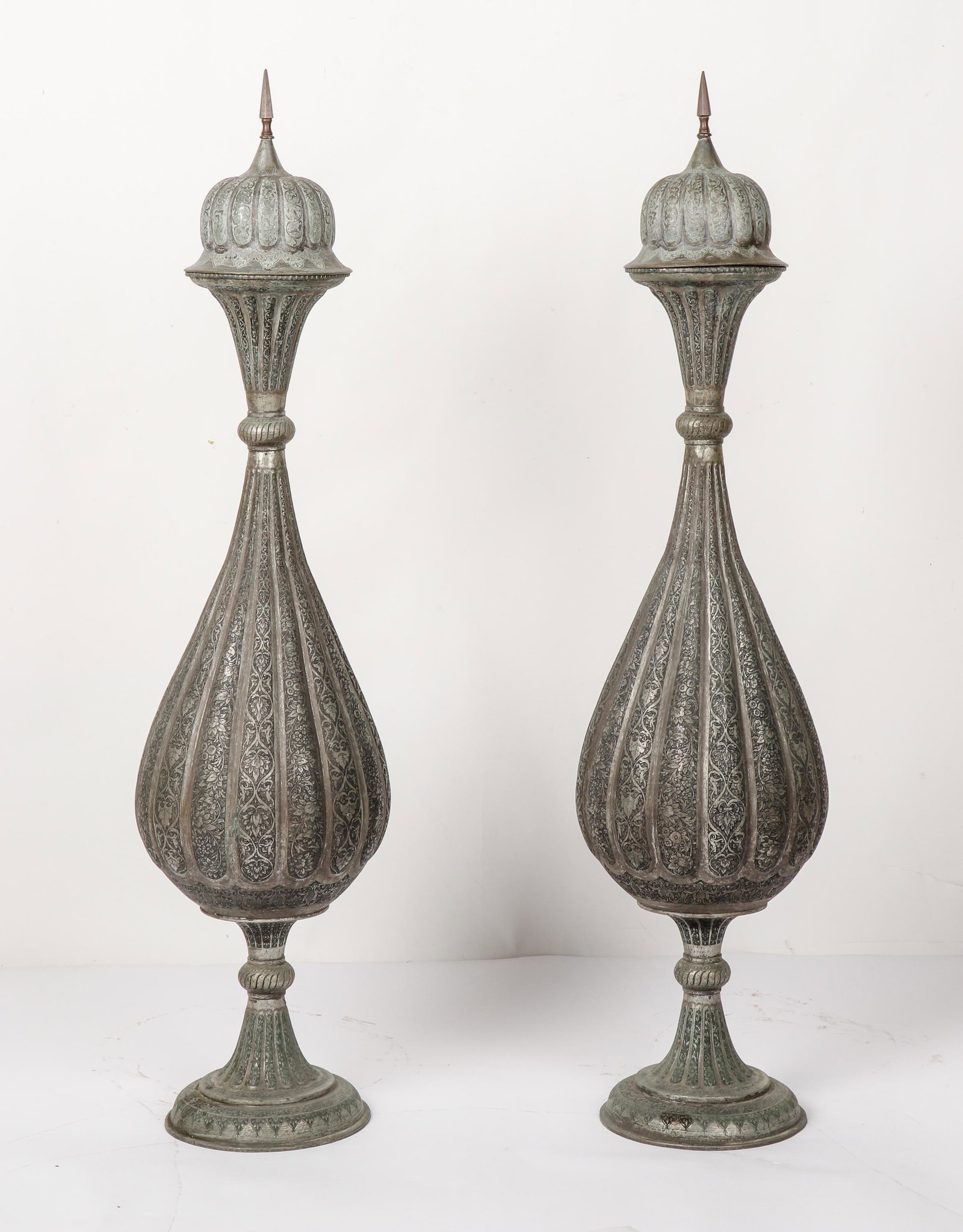 Pair of Antique Middle Eastern Tall Covered Etched Metal Vases, Ht. 47": Pair of Middle Eastern Tall Covered Etched Metal Vases. Size: Each 47'' x 10'' x 10'' (119 x 25 x 25 cm). Exhibition and Post-Auction Pickup Location: Material Culture, 4700 Wissahickon Ave., Philadel