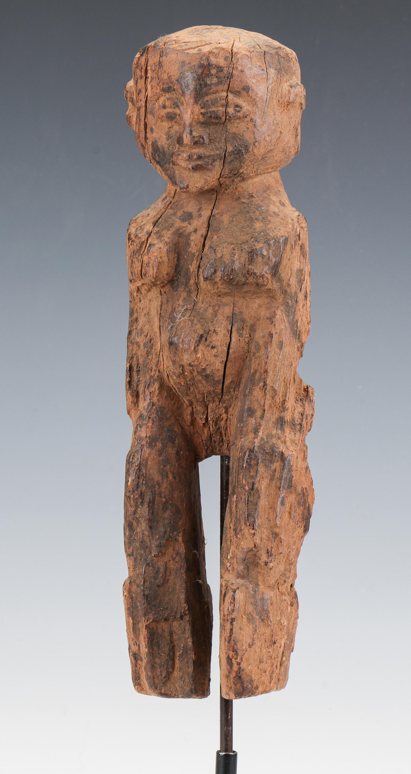 African Carved Wood Figure: African Carved Wood Figure. Ex. Collection William and Diane Bousquette, Purchase, New York. Size: 9.5'' x 2.75'' x 2'' (24 x 7 x 5 cm).