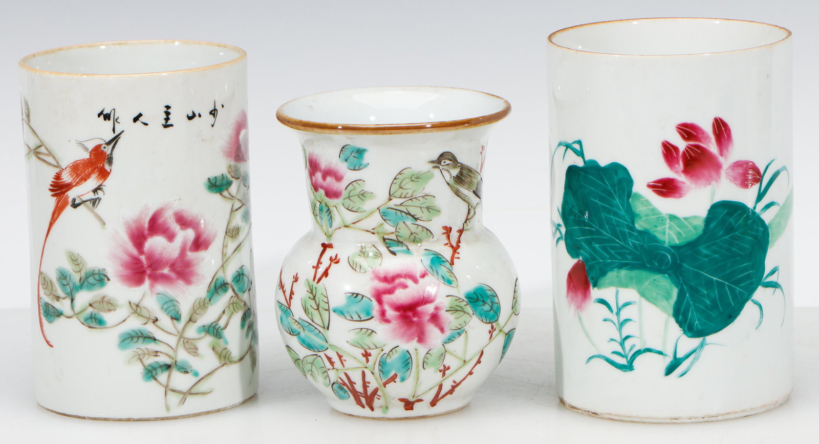 2 Chinese Famille Rose Brush Pots and a Vase: 2 Chinese Famille Rose Brush Pots and a Vase. Each with base with iron red marks. Ranging in size from: 4'' x 3.25'' x 3.25'' (10 x 8 x 8 cm) to 4.75'' x 3.25'' x 3.25'' (12 x 8 x 8 cm).