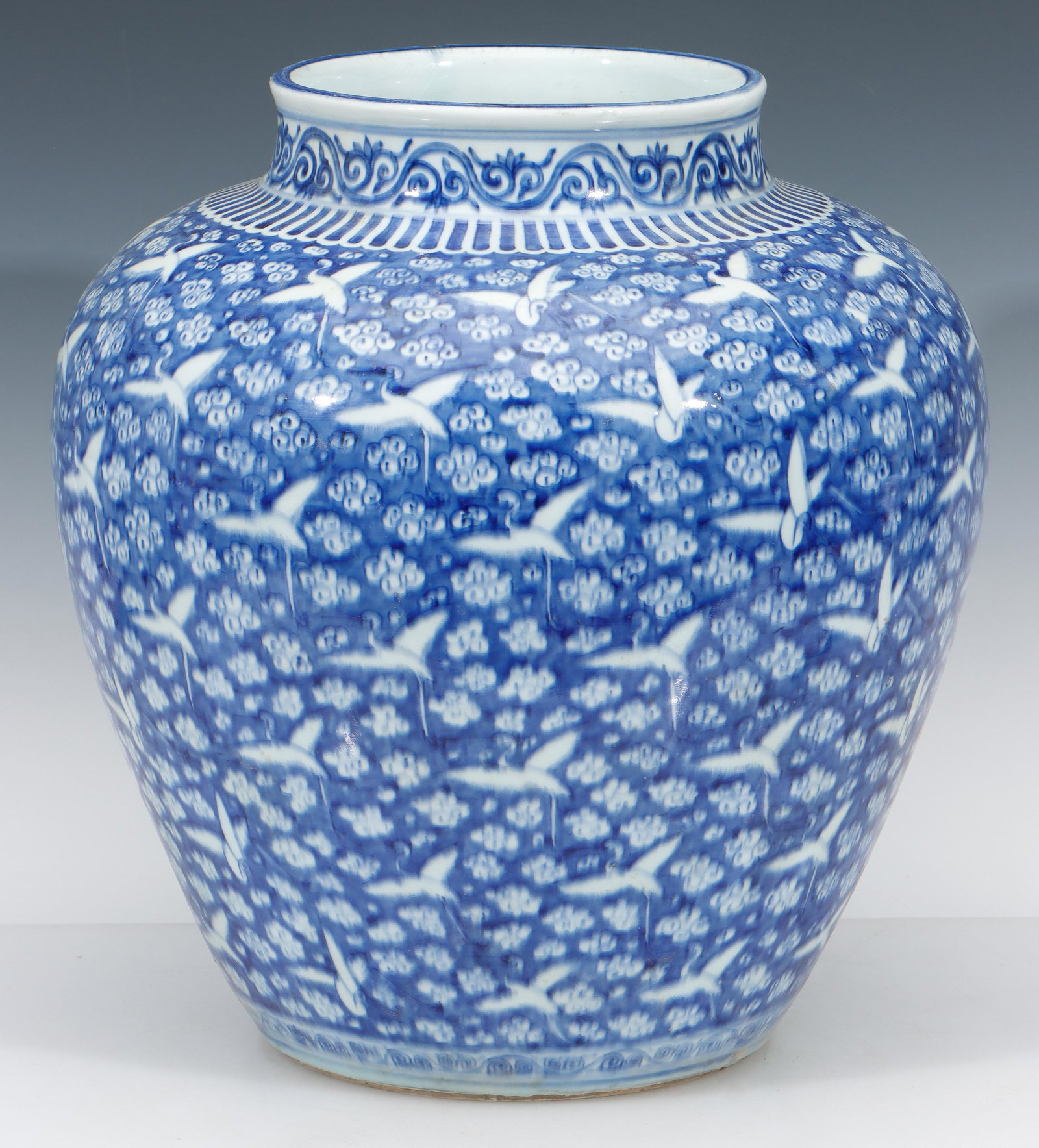 Chinese Blue and White Jar: Chinese Blue and White Jar. Hundred crane decoration. Base with glazed medallion with blue 6-character mark within double circle. Size: 15'' x 14'' x 14'' (38 x 36 x 36 cm).
