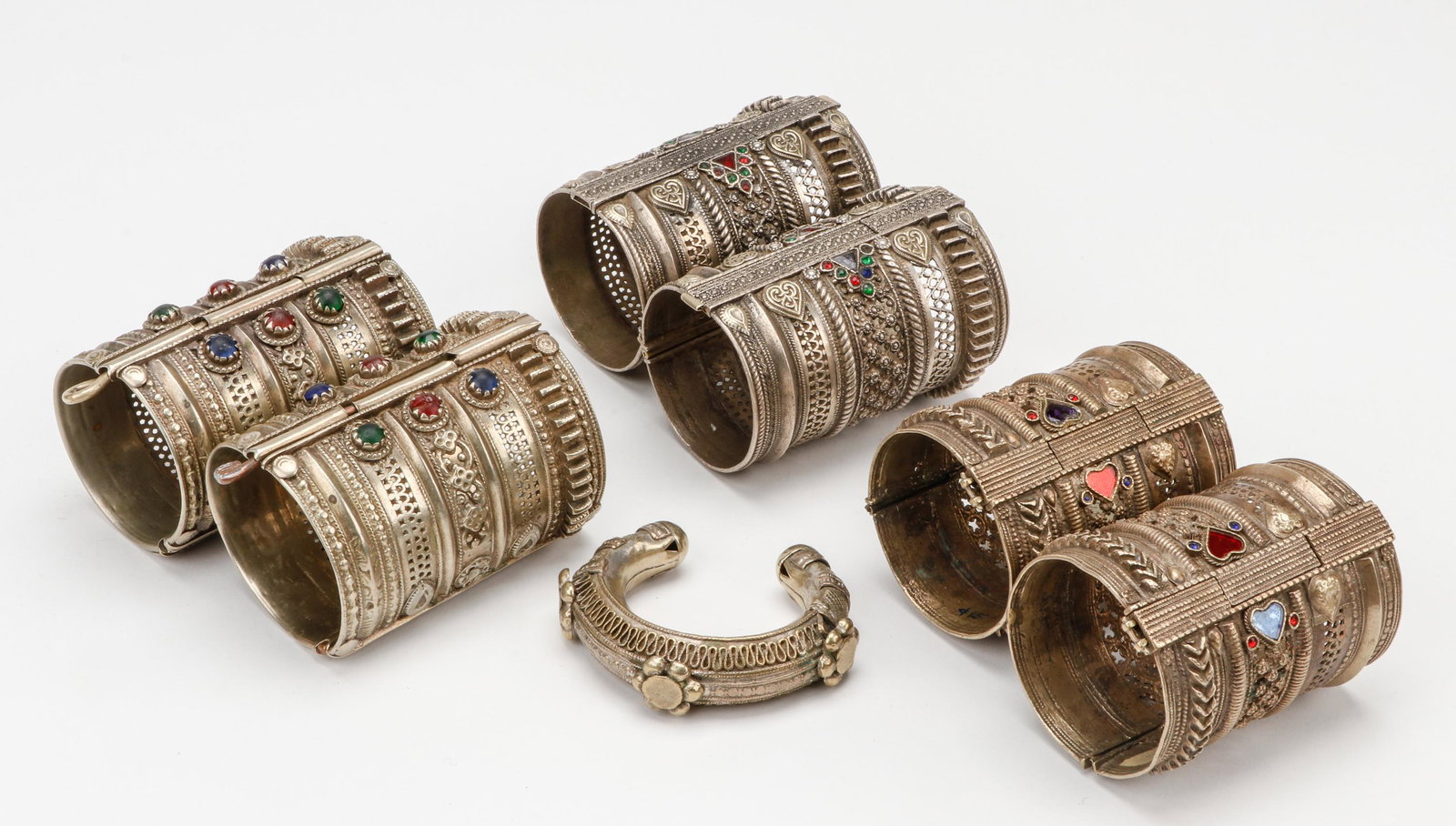 Collection of Pashtun "Koochi" Bracelets, Pakistan: Collection of Pashtun "Koochi" Bracelets, Pakistan. Size: Ranging from 2.75'' x 3.25'' x 1'' (7 x 8 x 3 cm) to 3.75'' x 2.5'' x 2.75'' (10 x 6 x 7 cm). Total weight: 53.32 ozt.