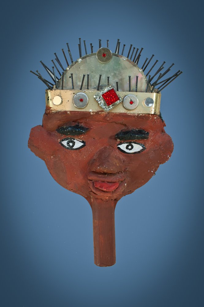 Gregory Warmack (aka Mr Imagination): American, b. 1948; Boy with crown; 2000; Mixed media on ping pong paddle; Height: 11 ½”