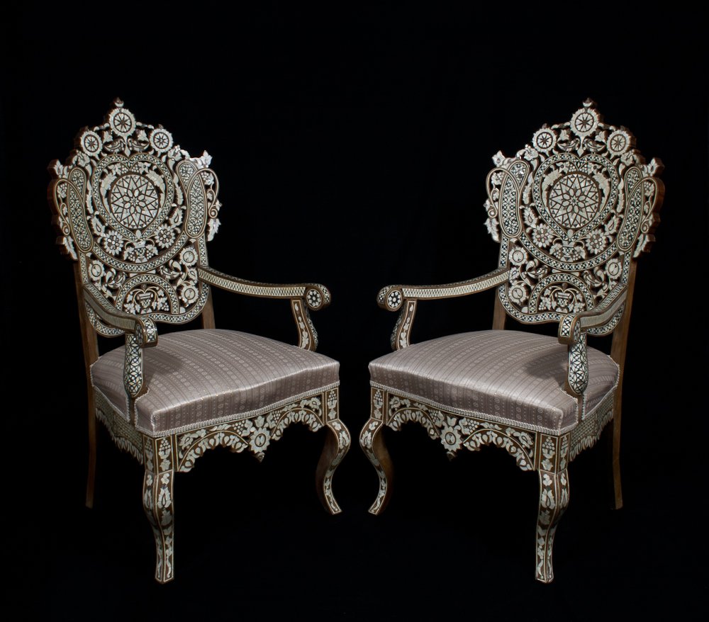 A Pair of Syrian Armchairs: Mother of Pearl and Bone inlaid. Walnut. Height: 50” Width: 25” Depth: 28”