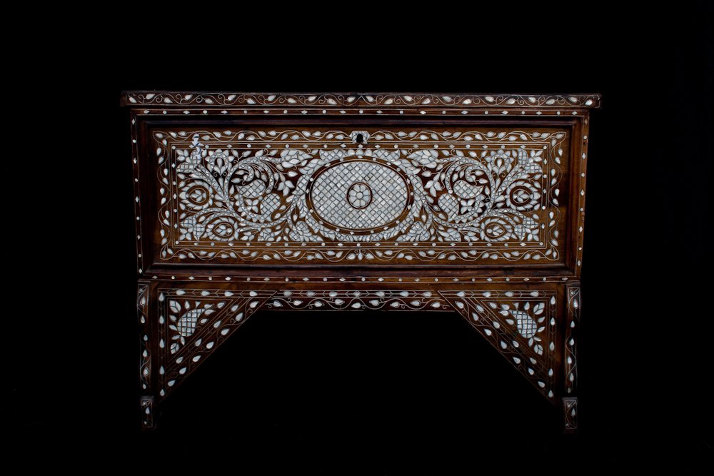 A Syrian Mother-Of-Pearl Chest: Mother of Pearl, Bone, and Wire inlaid in Walnut. early 20th c. Height: 37 ½” Width: 51” Depth: 18”