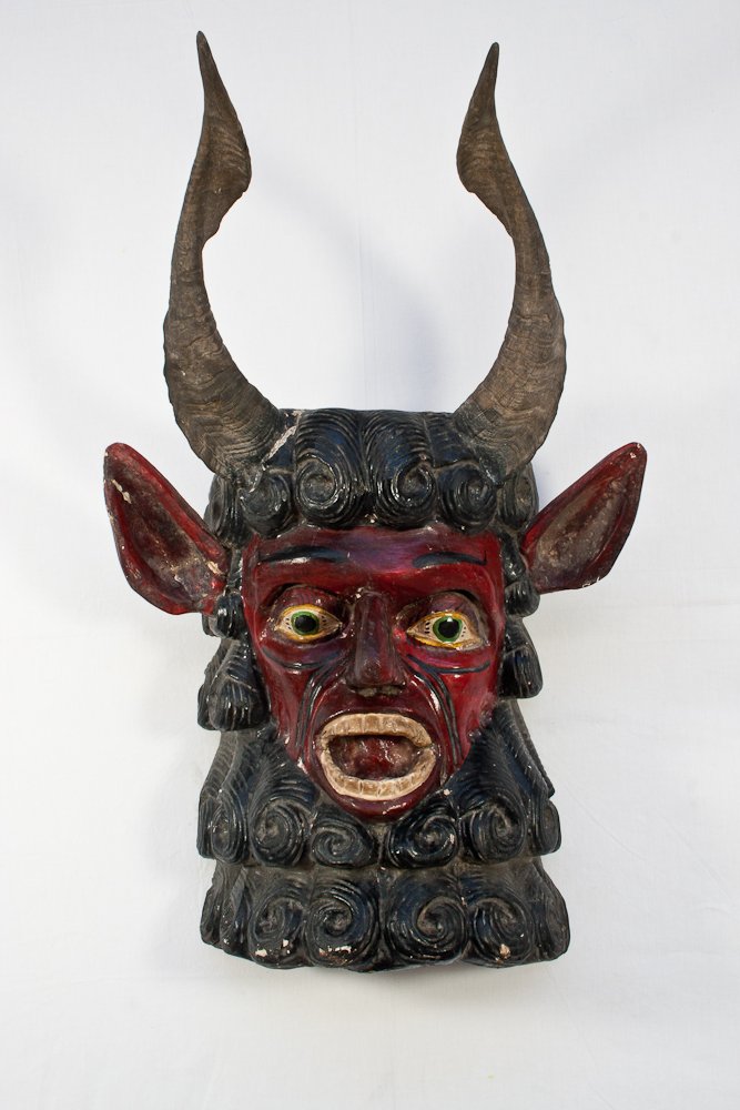 Polychrome Devil with Real Horns: Mexico, early 20th century, carved wood, some old repairs to ear and horn, 19” x 29”