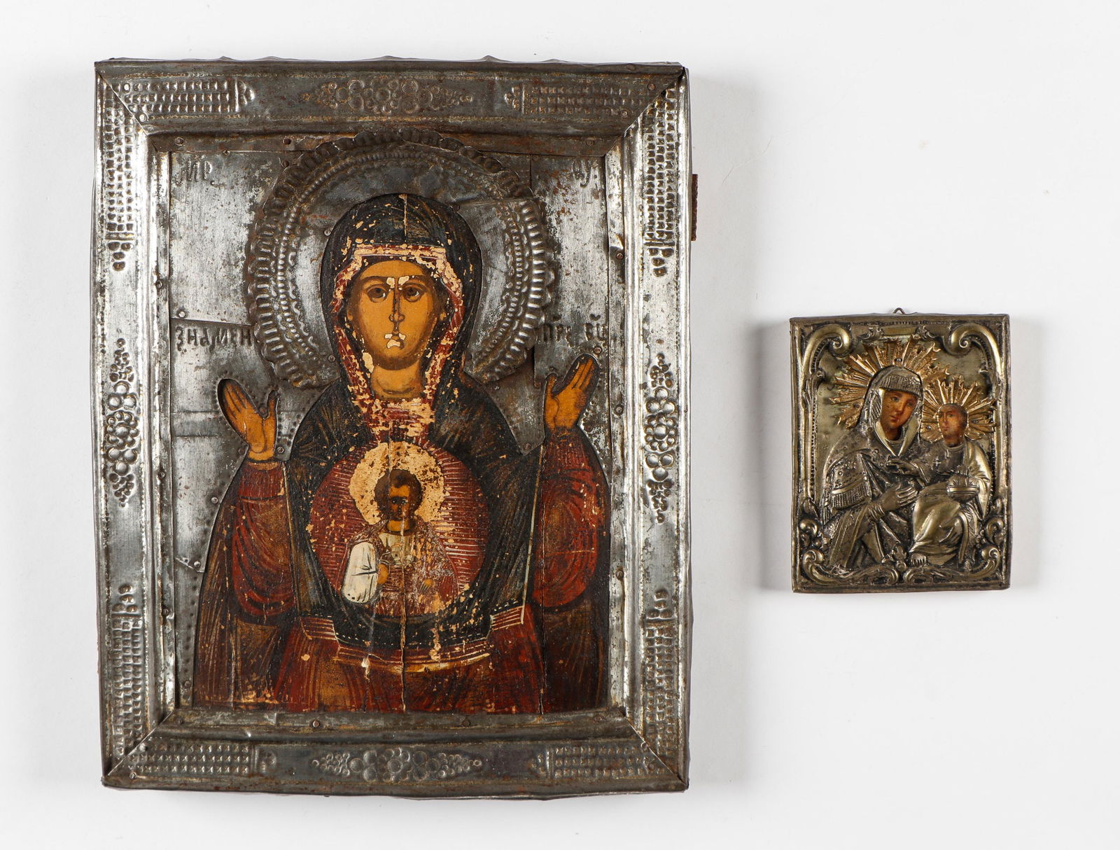 Two Icons of the Madonna and Child: Two Icons of the Madonna and Child. Tempera on board with gilt metal silver oklad. Size: 1) 4.75'' x 3.75'' x .5'' (12 x 10 x 1 cm); 2) 12'' x 10'' x 1'' (30 x 25 x 3 cm).