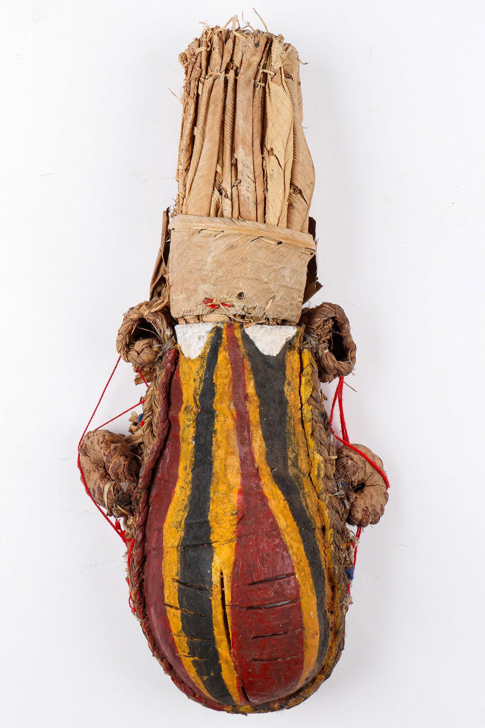 African Afikpo Igbo Calabash Mask, Nigeria: African Afikpo Igbo Calabash Mask, Nigeria. Gourd, plant fiber, pigment, fiber. Size: 22'' x 9'' x 5'' (56 x 23 x 13 cm).