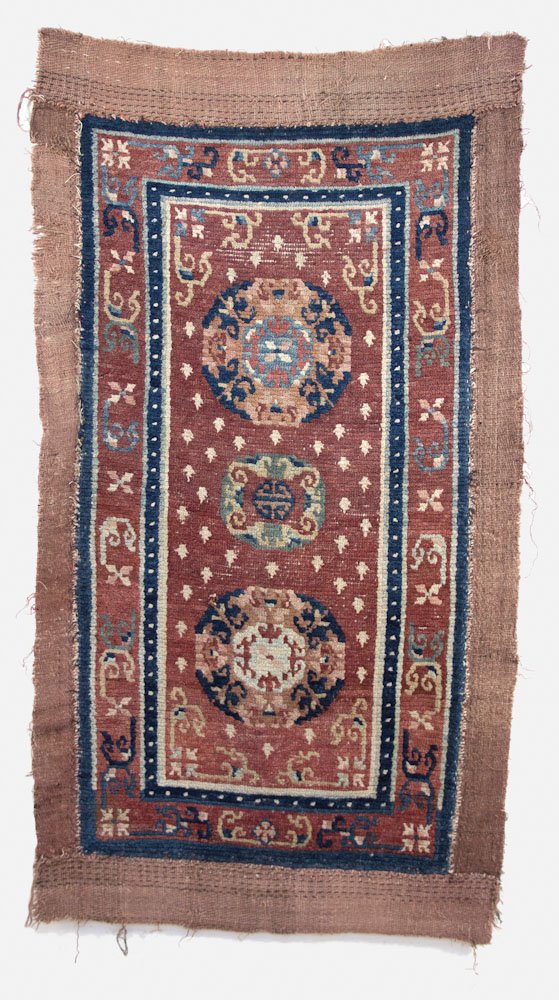 Archaic "Frog Foot" Tibetan Rug: Archaic "Frog Foot" Tibetan Rug - Tibet, 19th c, 3 medallion khaden with wide flatweave border. Literature: HALI magazine, issue 169, Tom Cole, "Tale From the Hills" Prov: Bill Liske Dimensions: 2'10"