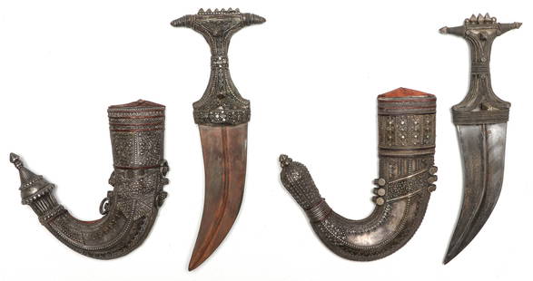 2 Antique Middle Eastern Jambiya Daggers: 2 Antique Middle Eastern Jambiya Daggers. Forged steel with a distinctive curved blades, in ornate silver sheaths. Size: 1) 8'', 20 cm (blade); 13.5'', 34 cm (overall); 2) 7.5'', 19 cm (blade); 14'',