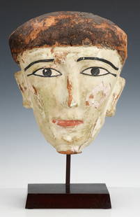 Ancient Egyptian Sarcophagus Mask: Ancient Egyptian Sarcophagus Mask. Carved wood and pigment. On stand. Size: 13'' x 11'' x 4.5'' (33 x 28 x 11 cm).