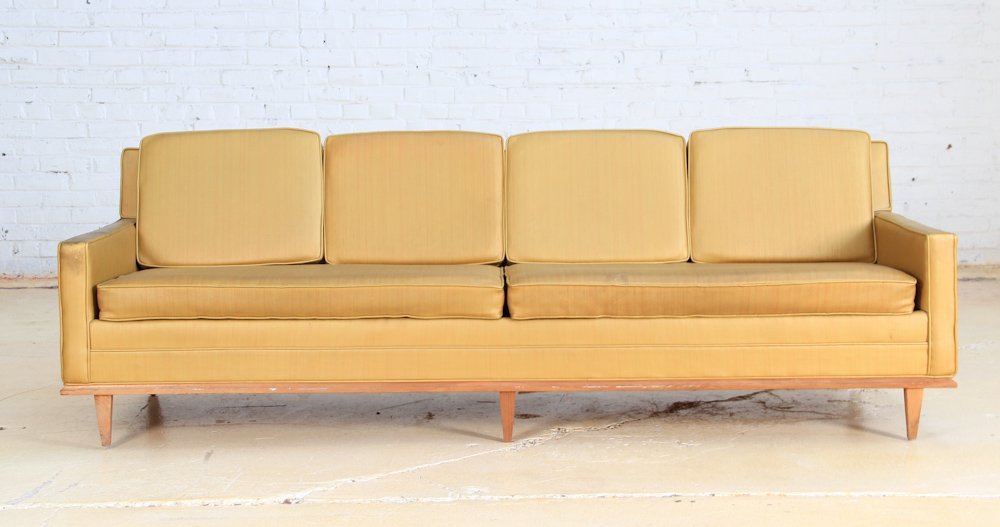 Mid Century Upholstered and Wood Couch: Modern Mid Century yellow couch with wooden base and legs (faux leather). Dimensions: 30 x 91 x 33 inches.