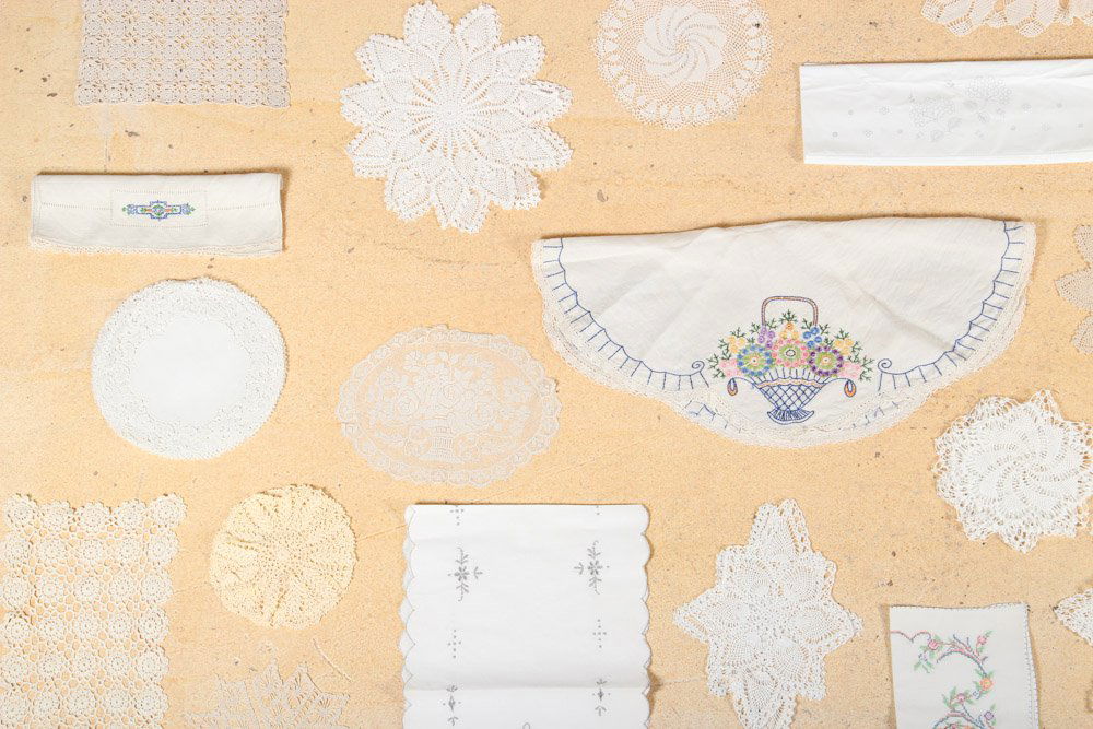 Collection of pillowcases, Doilies, table cloth, runner: Collection of pillowcases, Doilies, table cloth, runner, napkins and place mats. Dimensions: ranging in size from: 36" x 16" to 4" x 4" inches.