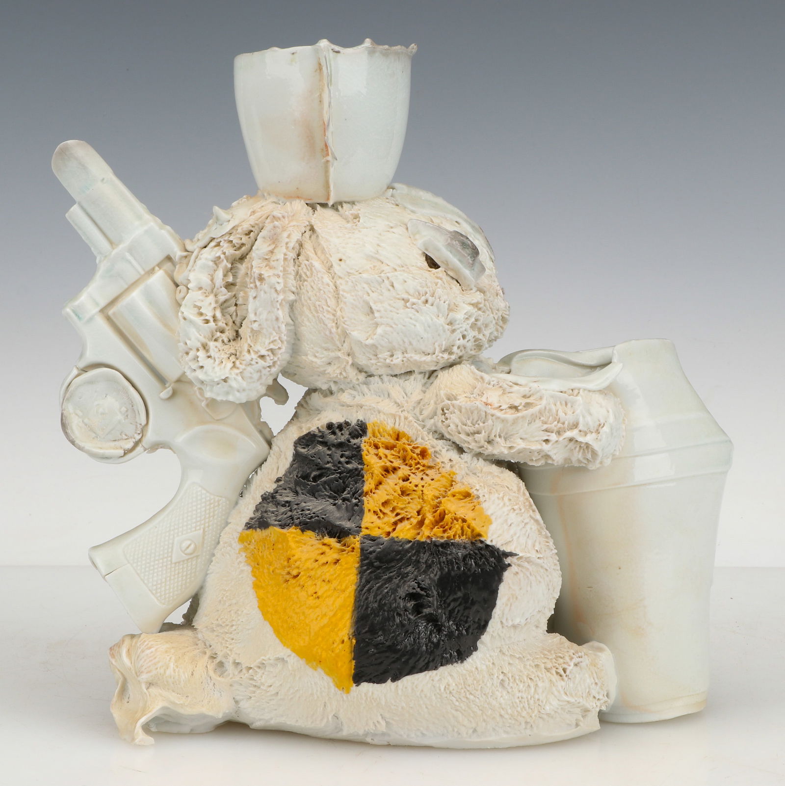 Casey O'Connor (American, 20th/21st C.) Untitled Ceramic Bunny with Revolver: Casey O'Connor (American, 20th/21st C.) Untitled Ceramic Bunny with Revolver. Size: 10'' x 5'' x 10'' (25 x 13 x 25 cm). Provenance: The Robert L. Pfannebecker Collection. Artist Biography: Casey O'Co