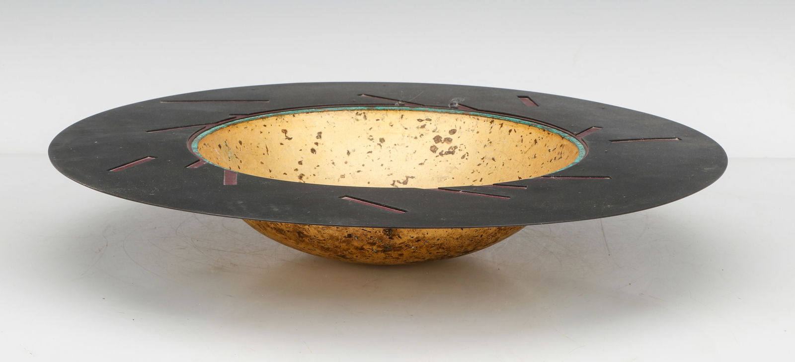 Helen Shirk (b. 1942) Metal Centerpiece, 1989: Helen Shirk (American, b. 1942) Metal Centerpiece, 1989, signed and dated. Size: 2.5'' x 16.5'' x 16.5'' (6 x 42 x 42 cm). Provenance: The Robert L. Pfannebecker Collection. Artist Biography: Helen Sh