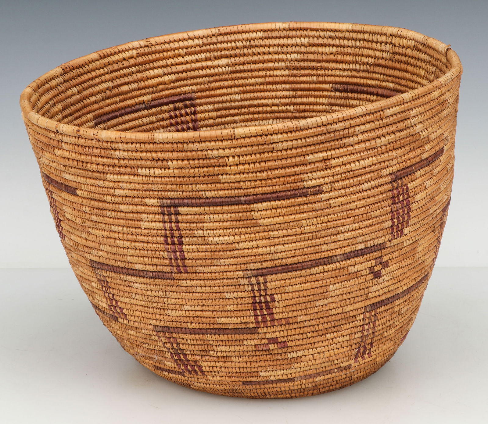 Native American Basket: Native American Basket. Plant fiber. Size: 10.5'' x 14'' x 14'' (27 x 36 x 36 cm). Provenance: The Robert L. Pfannebecker Collection.