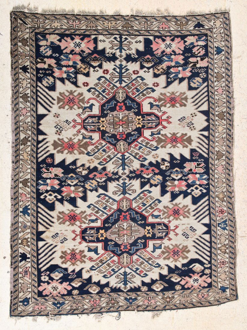 Kuba Rug: Kuba Rug, Caucasus, circa 1900, areas of wear, frayed ends Size: 4' 10" x 3' 9". Cost for us to pack and ship this item via UPS GROUND in the continental USA (includes insurance, with signature requir
