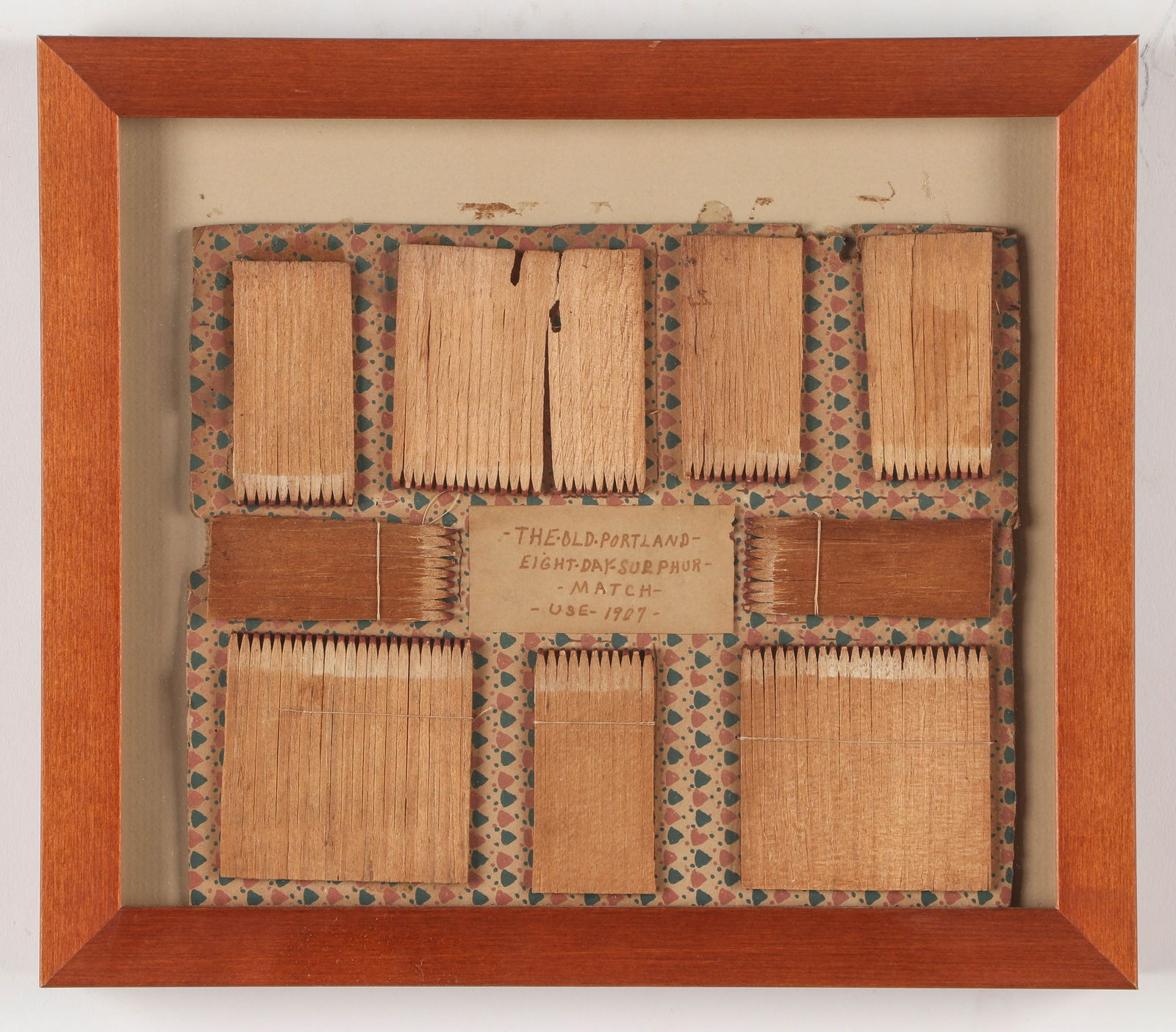 Framed Sulphur Match Folk Art: Folk Art "The Old Portland Eight Day Sulphur Match Use 1907," Size: 7'' x 8.5'', 18 x 22 cm (sheet); 9.75'' x 11'', 25 x 28 cm (frame). Provenance: The Robert L. Pfannebecker Collection.