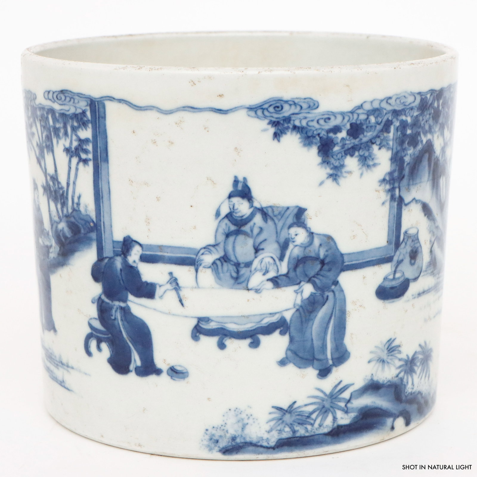 Chinese Blue and White Porcelain Brush Pot: Chinese Blue and White Porcelain Brush Pot. Cylindrical form adorned with scholars before a seated dignitary. Base with sunken glazed roundel with blue 6-character mark. Size: 6.75'' x 8'' x 8'' (17 x