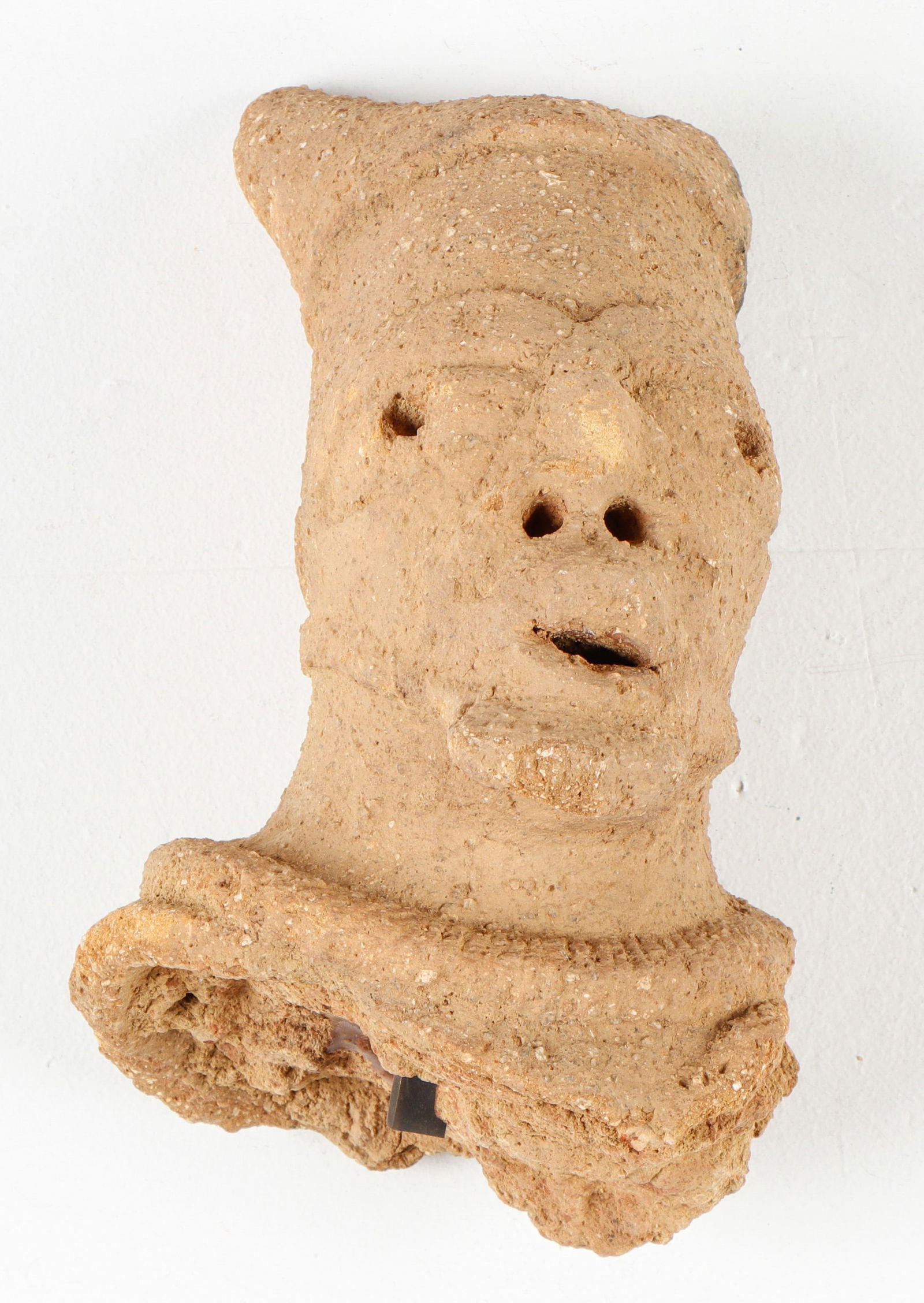 African Nok Terracotta Head, Nigeria: African Nok Terracotta Head, Nigeria. Property of a New York Collector. Size: 9'' x 6'' x 7'' (23 x 15 x 18 cm).