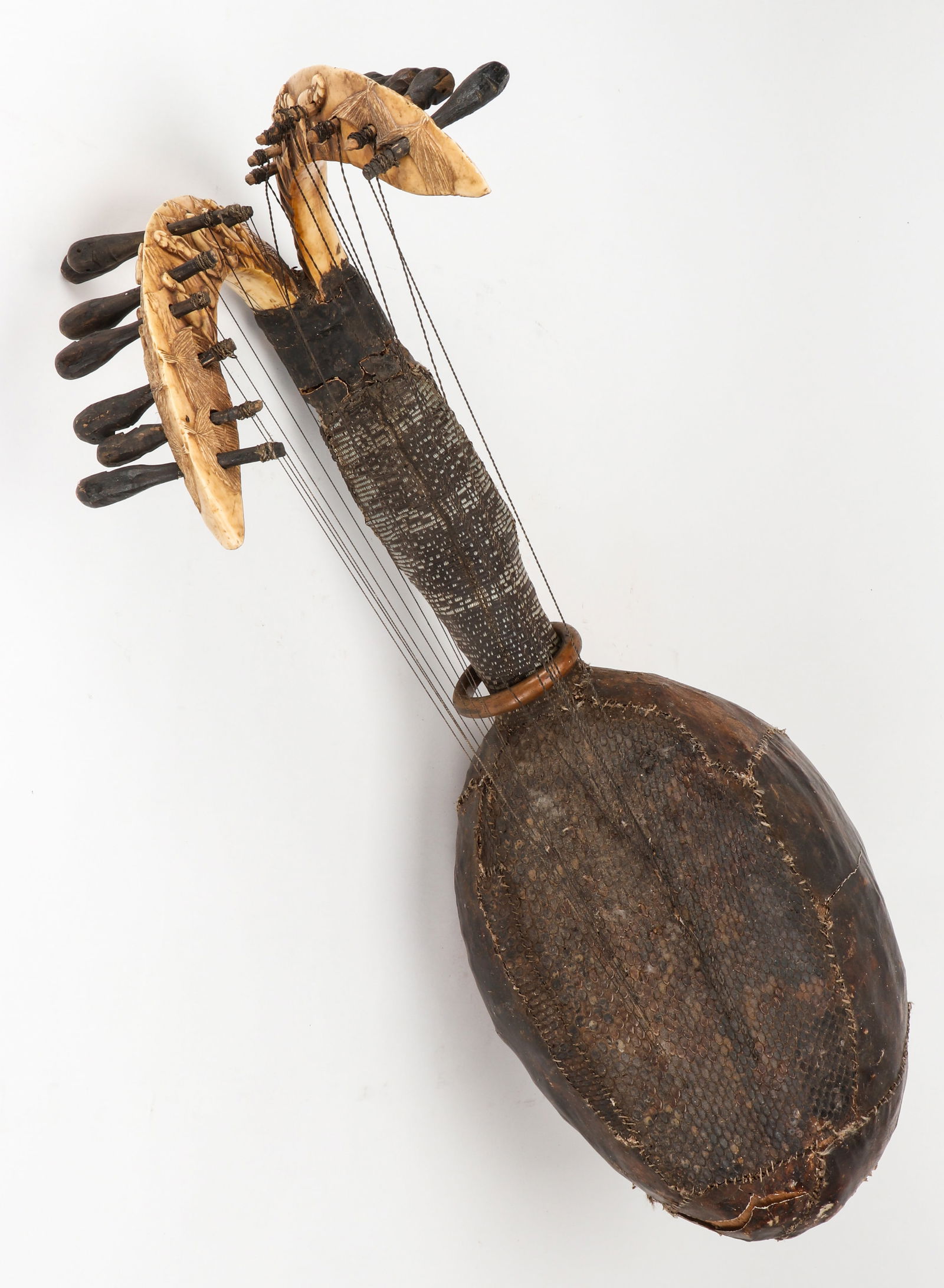African Loango Harp, DRC: African Loango Harp, DRC. Wood, bone, skin and string. Size: 30'' x 94'' x 14.5'' (76 x 239 x 37 cm)