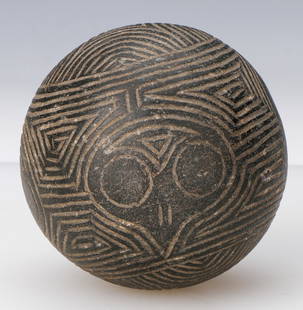 Taino Pre-Columbian Ceremonial Ball: Taino Pre-Columbian Ceremonial Ball. With 4 incised bird heads running in a band around ball. The bird heads can be inverted to reveal a second abstract face. On either sides of the band ie top and bo