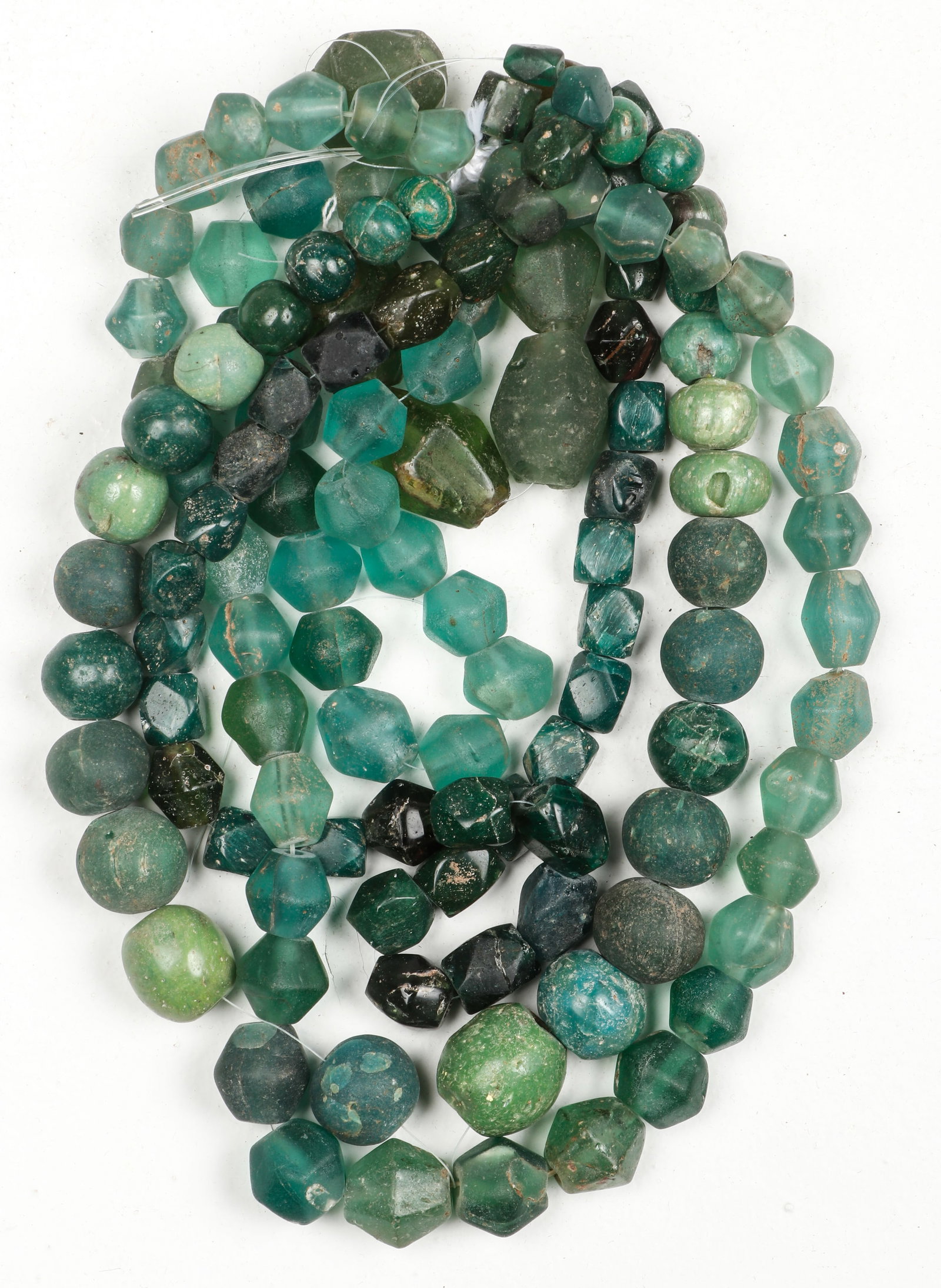 Ancient Chinese Trade Glass Beads: Ancient Chinese Trade Glass Beads. Found and used in Indonesia. Bead size ranging from .25'' x .25'' x .25'' (1 x 1 x 1 cm) to 1'' x .75'' x .75'' (3 x 2 x 2 cm).