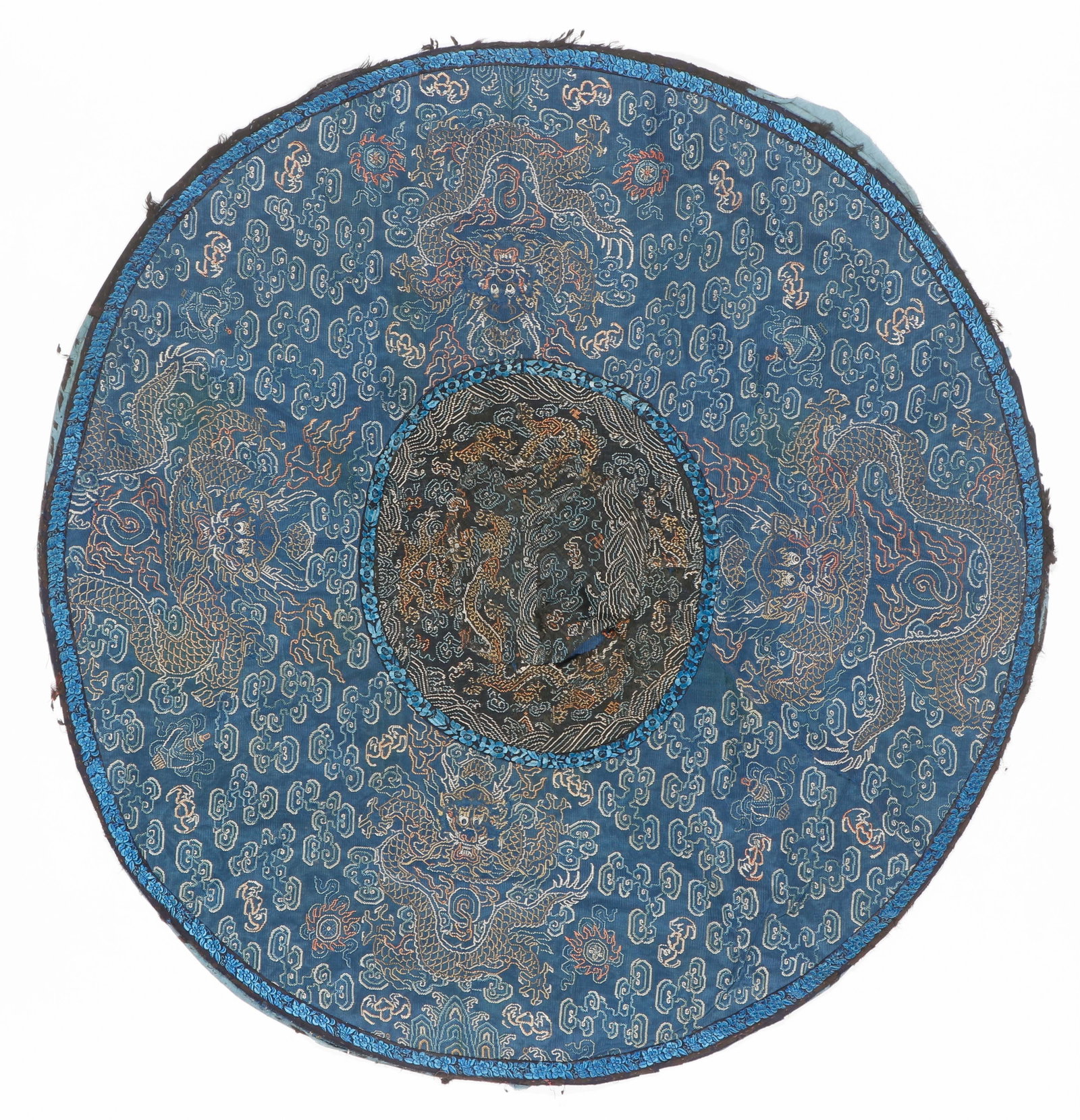 Chinese Dragon Roundel, Qing Dynasty: Chinese Dragon Roundel, Qing Dynasty. Blue silk adorned with silk and gold metal thread intertwining, featuring embroidered dragons amidst stylized clouds and bats. Size: 34'' x 34'' (86 x 86 x cm). P