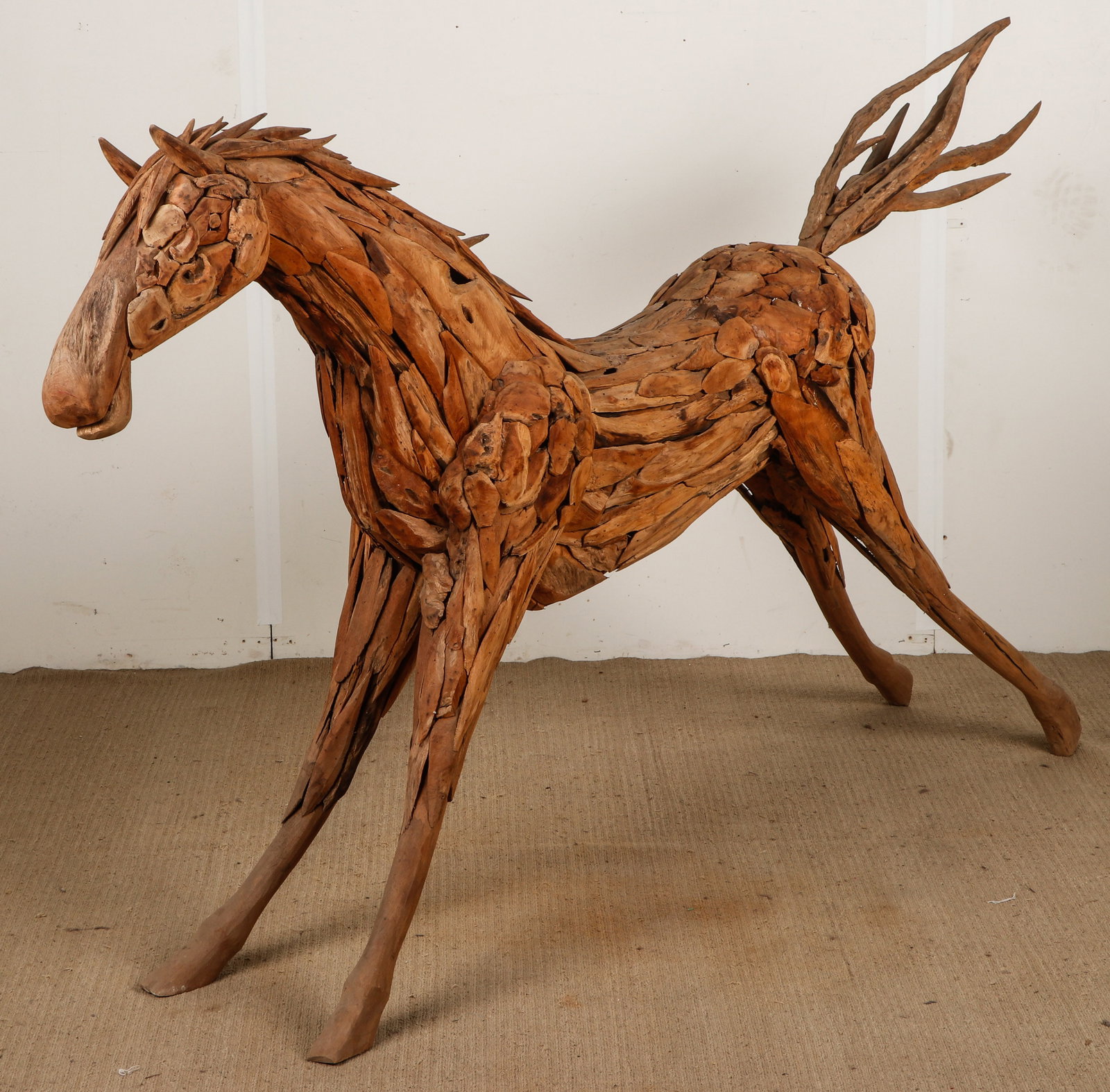 Teak Chip Sculpture of a Horse, L: 7'2": Teak Chip Sculpture of a Horse. Size: 47'' x 86'' x 13'' (119 x 218 x 33 cm).