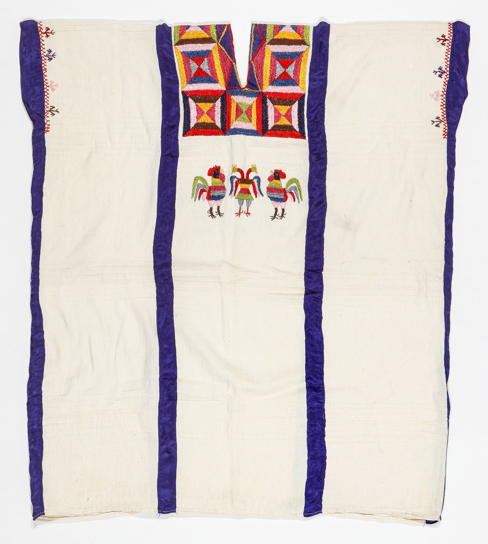 White Cotton Huipil, Oaxaca, Mexico, Early/Mid 20th C.: White Cotton Huipil, Oaxaca, Mexico, Early/Mid 20th C. Embroidered with coiled silk thread in satin stitch and further embellished with blue silk ribbon. Featuring a wide borders of geometrics at the 