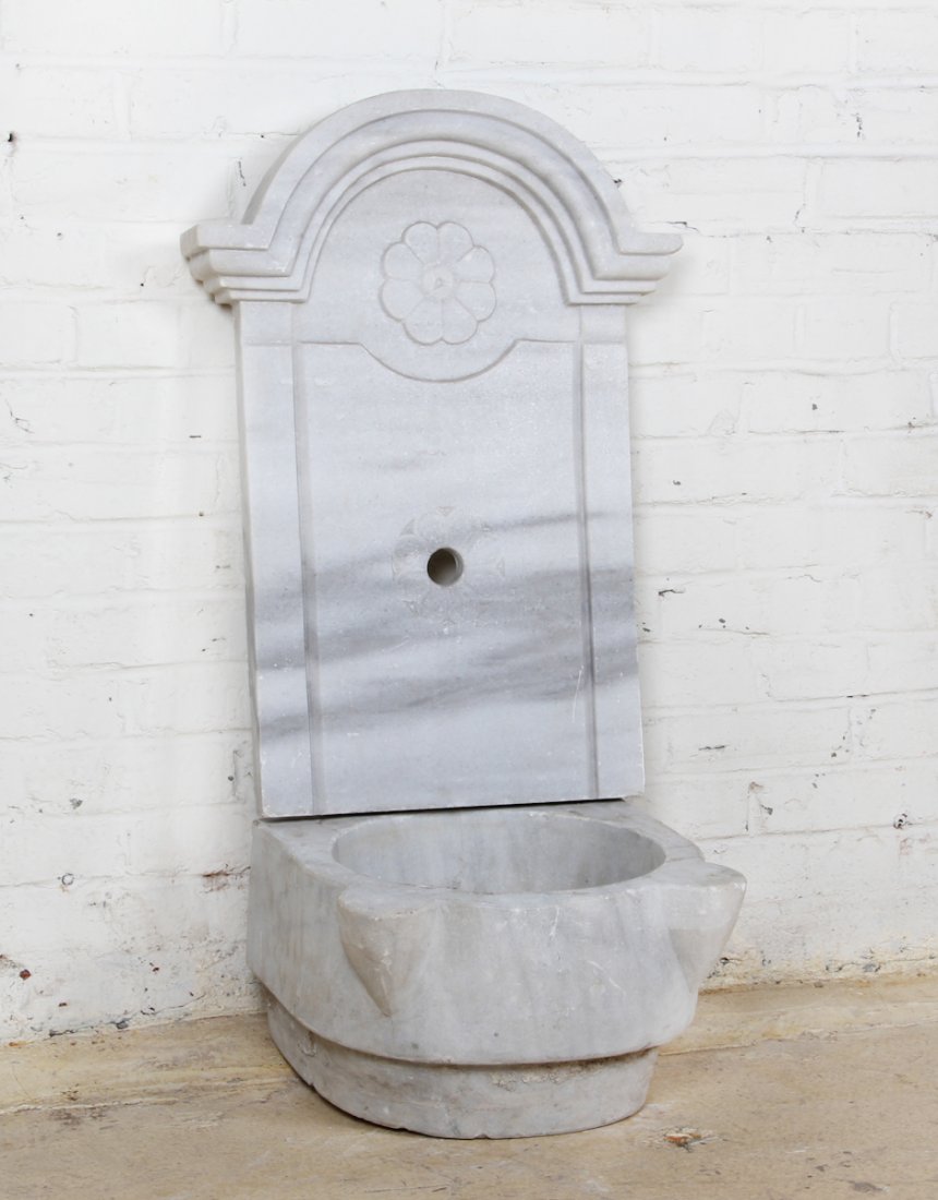 19th C Ottoman Marble Wall Fountain: An Ottoman Marble Wall Fountain, Turkey, 19th c, comprising dished basin and decorated carved wall back. Size: 9-1/2 x 15 x 14-1/2 inches (basin), 27-3/4 x 19-3/4 x 3 inches (backsplash).