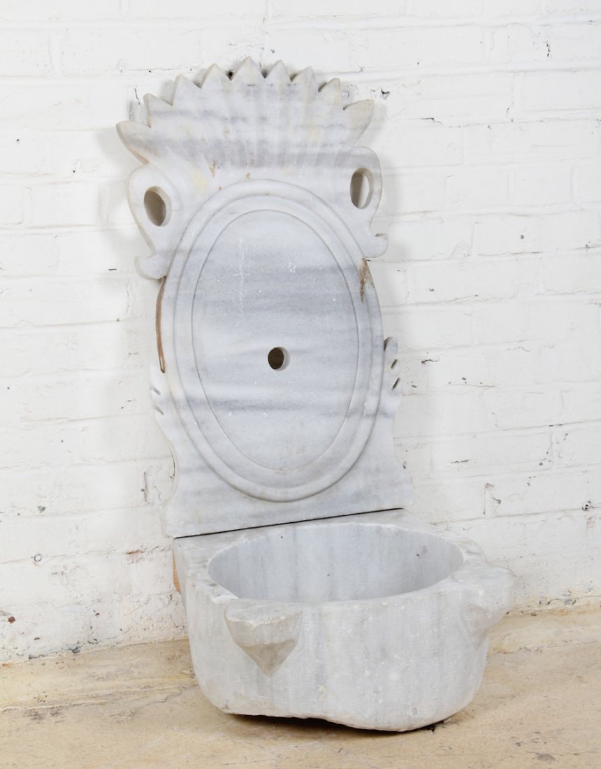 19th C Ottoman Marble Wall Fountain: An Ottoman Marble Wall Fountain, Turkey, 19th c, comprising dished basin and decorated carved wall back. Size: 8-3/4 x 16-1/2 x 16-1/2 inches (basin), 28 x 16 x 1-1/2 inches (backsplash).