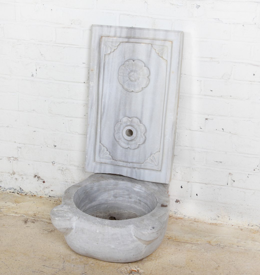 19th C Ottoman Marble Wall Fountain: An Ottoman Marble Wall Fountain, Turkey, 19th c, comprising dished basin and decorated carved wall back. Size: 7 x 16 x 17 inches (basin) 22-1/2 x 14 x 2 (backsplash).