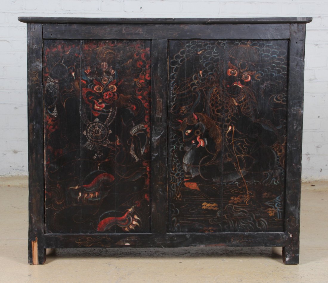 Tibetan Monastery Cabinet: Tibetan Monastery Cabinet, early 20th c, black lacquer, polychrome figures. Dimensions: 36 x 14 x 42 inches.