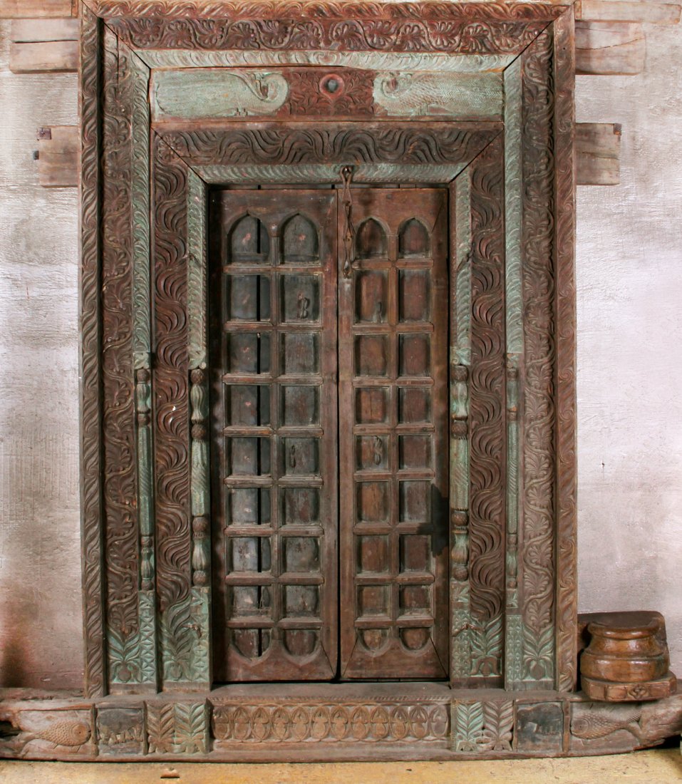 Carved Wood Temple Entrance: Carved Wood Temple Entrance, Nepal, pre 1800, traces of green paint. Size: 96 x 78 x 9 inches.