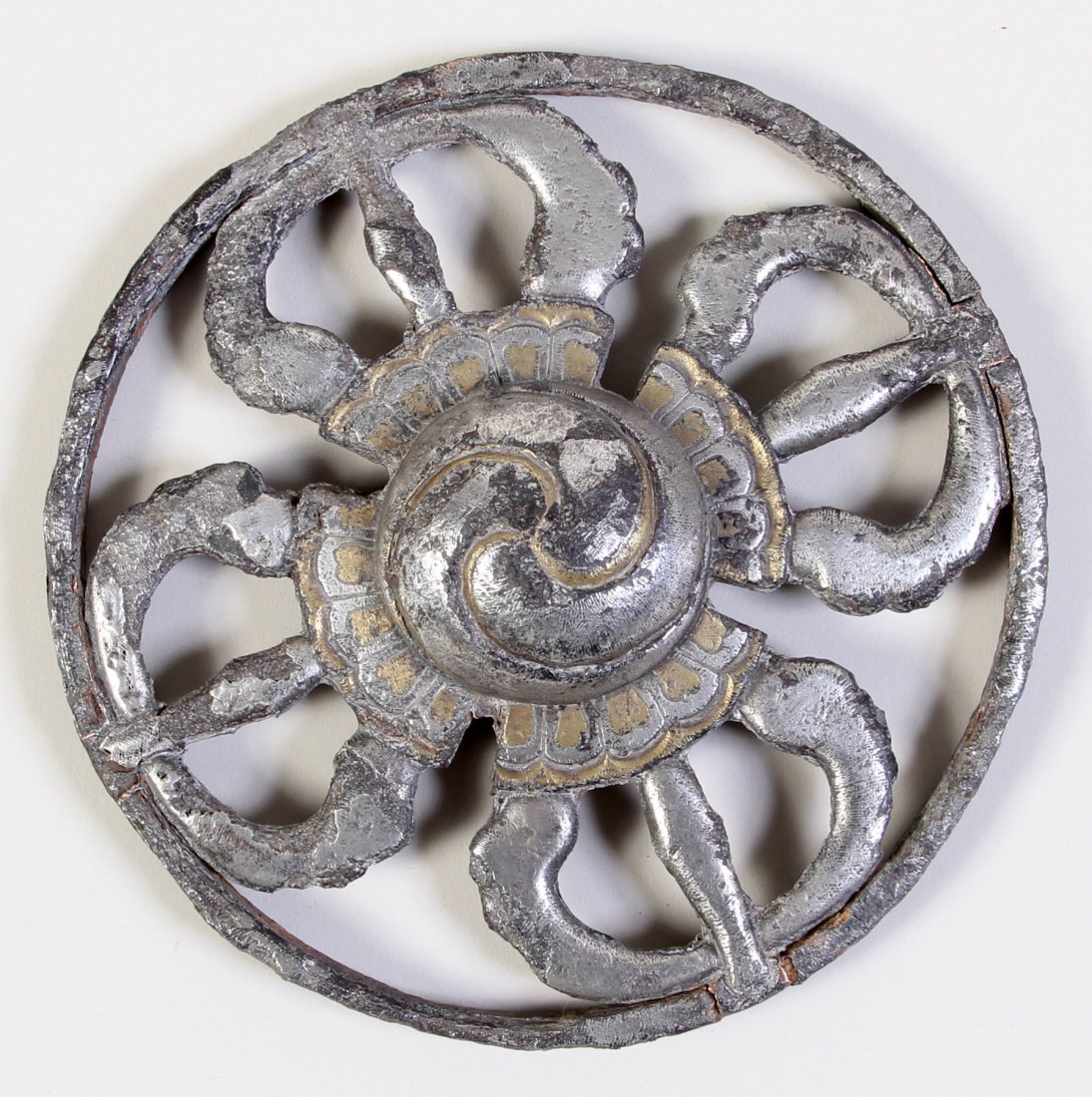 Wrought Iron Roundel of Double Dorjes, 15th-17th c.: Wrought iron sculptural roundel of double dorjes w/ silver and gold chasing. Tibet, 15th-17th c. Provenance: Bill Liske. Size: 1 (h) x 6 (d) inches (2.54 x 15.24 cm).