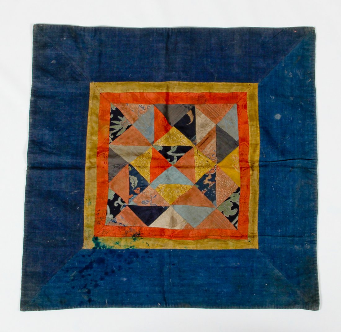 Pieced Tibetan Ritual Altar Cover - 17th/18th c.: Pieced Tibetan Ritual Altar Cover - 17th/18th c. Chinese silk brocade triangular quilted center w deep blue raw silk border, possibly from Bhutan. Provenance: Bill LiskeSize: 26 x 26 inches.
