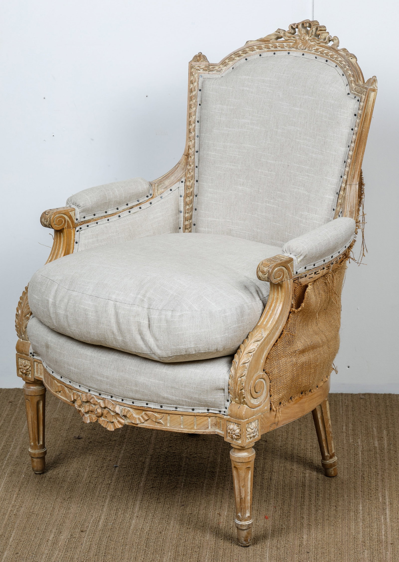 Louis XVI Style Beech Wood Bergere: Louis XVI Style Beech Wood Bergere. Size: 38'' x 26'' x 27'' (97 x 66 x 69 cm).After making payment, all furniture buyers must collect and remove their purchases from Material Culture's facility withi