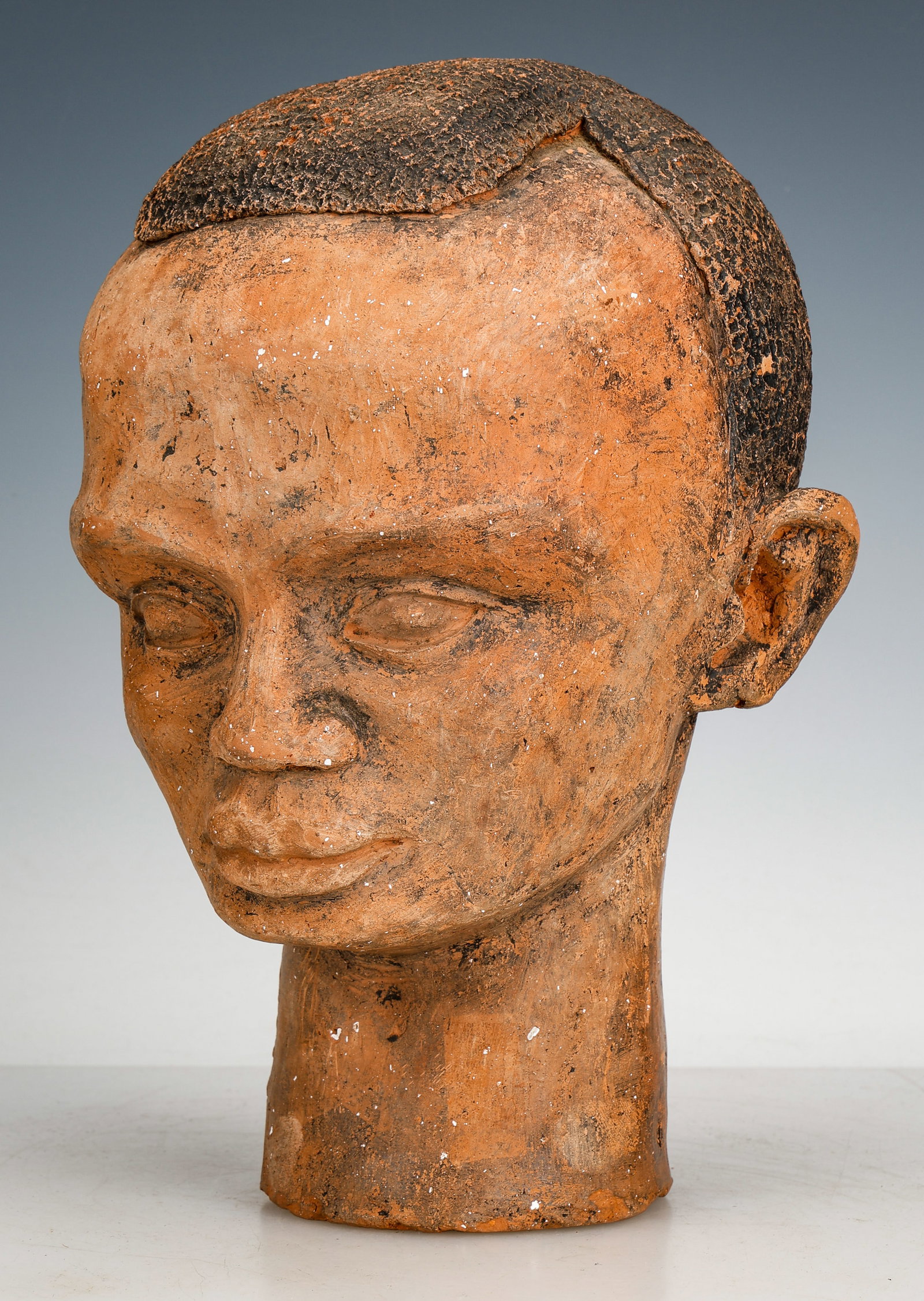 Vintage Terracotta Head of a Young Black Man By An Artist Unknown: Vintage Terracotta Head of a Young Black Man By An Artist Unknown. Nicely detailed. Size: 11'' x 8'' x 7'' (28 x 20 x 18 cm).