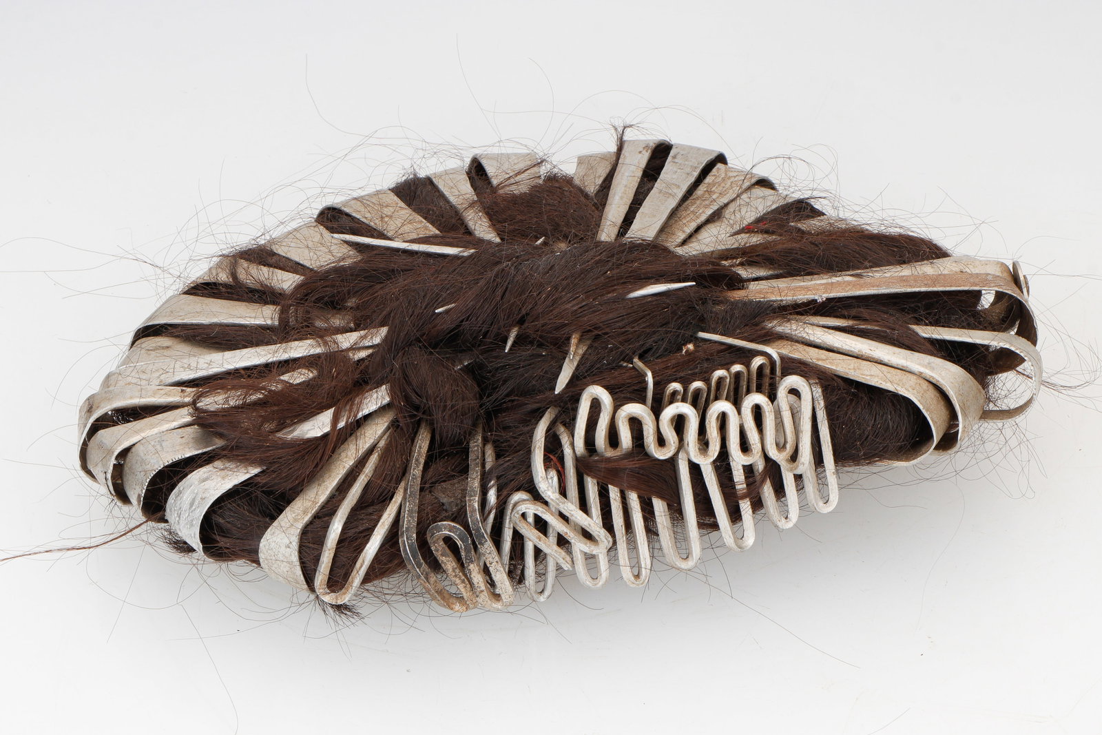 Karen Hairpiece, Burma/Thailand, C. 1900: Karen Hairpiece, Burma/Thailand, C. 1900. Human hair and aluminum. Size: 8'' x 11'' x 2'' (20 x 28 x 5 cm).