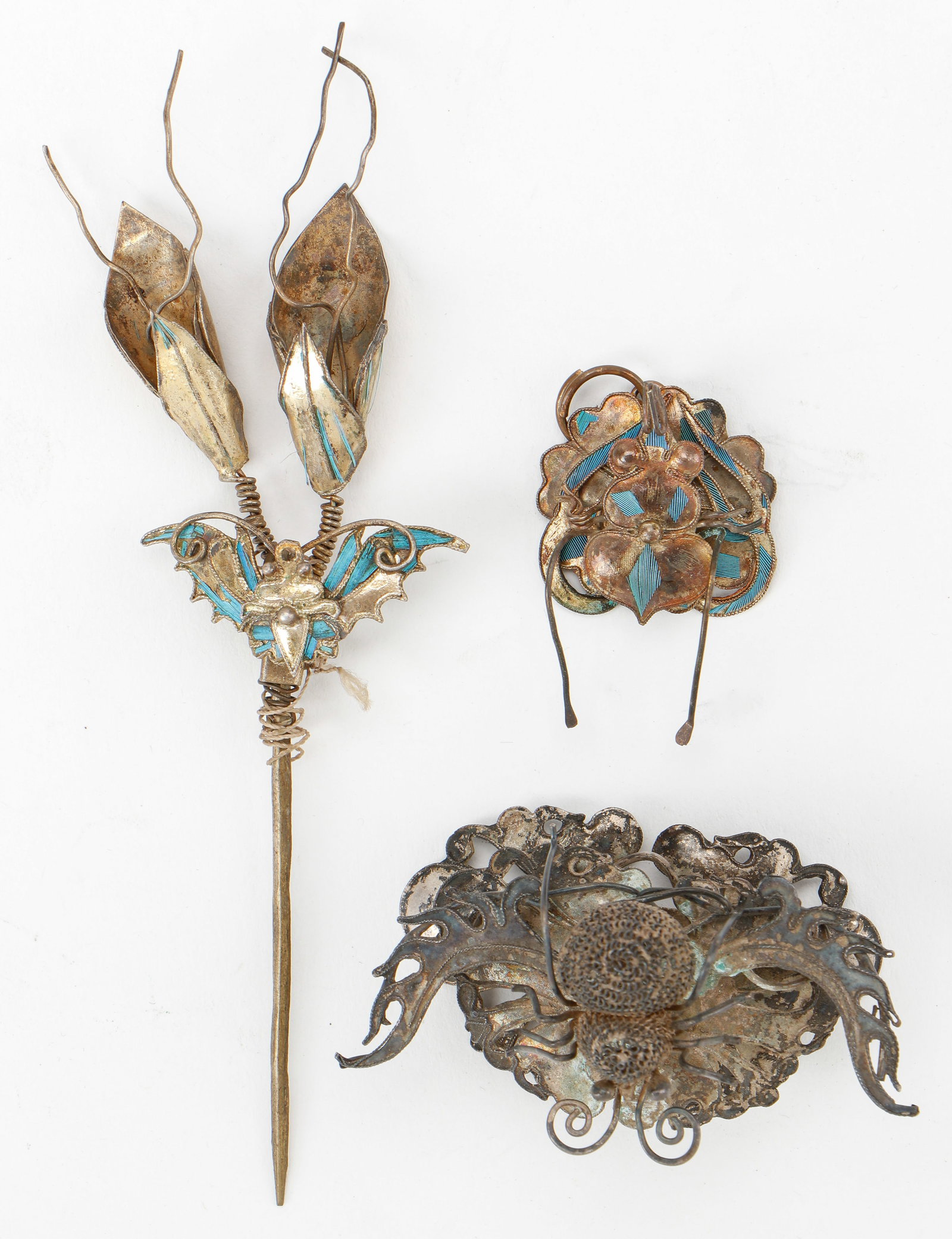 3 Antique Chinese Hair And Hat Adornments: 3 Antique Chinese Hair And Hat Adornments. Silver allot with remnant kingfisher feathers. Sizes Ranging From: 1'' x 1'' (3 x 3 cm); To: 5'' x 1'' (13 x 3 cm). Provenance: Collection of Brooke and Dov