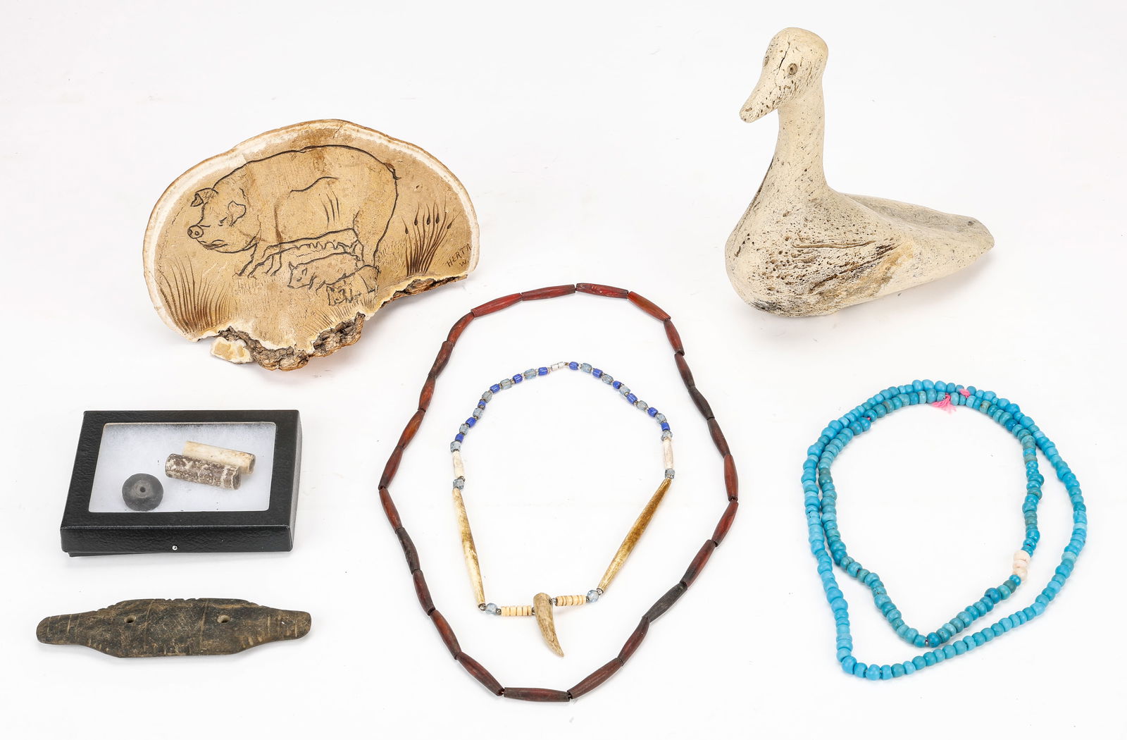 Collector's Lot of Native and Folk Art: Collector's Lot of Native and Folk Art. Including a folk art fungus illustration, carved stone gorget, Native American beaded necklaces, and a carved bone bird. Sizes Ranging From: 1'' x 1" x 1" (2 x