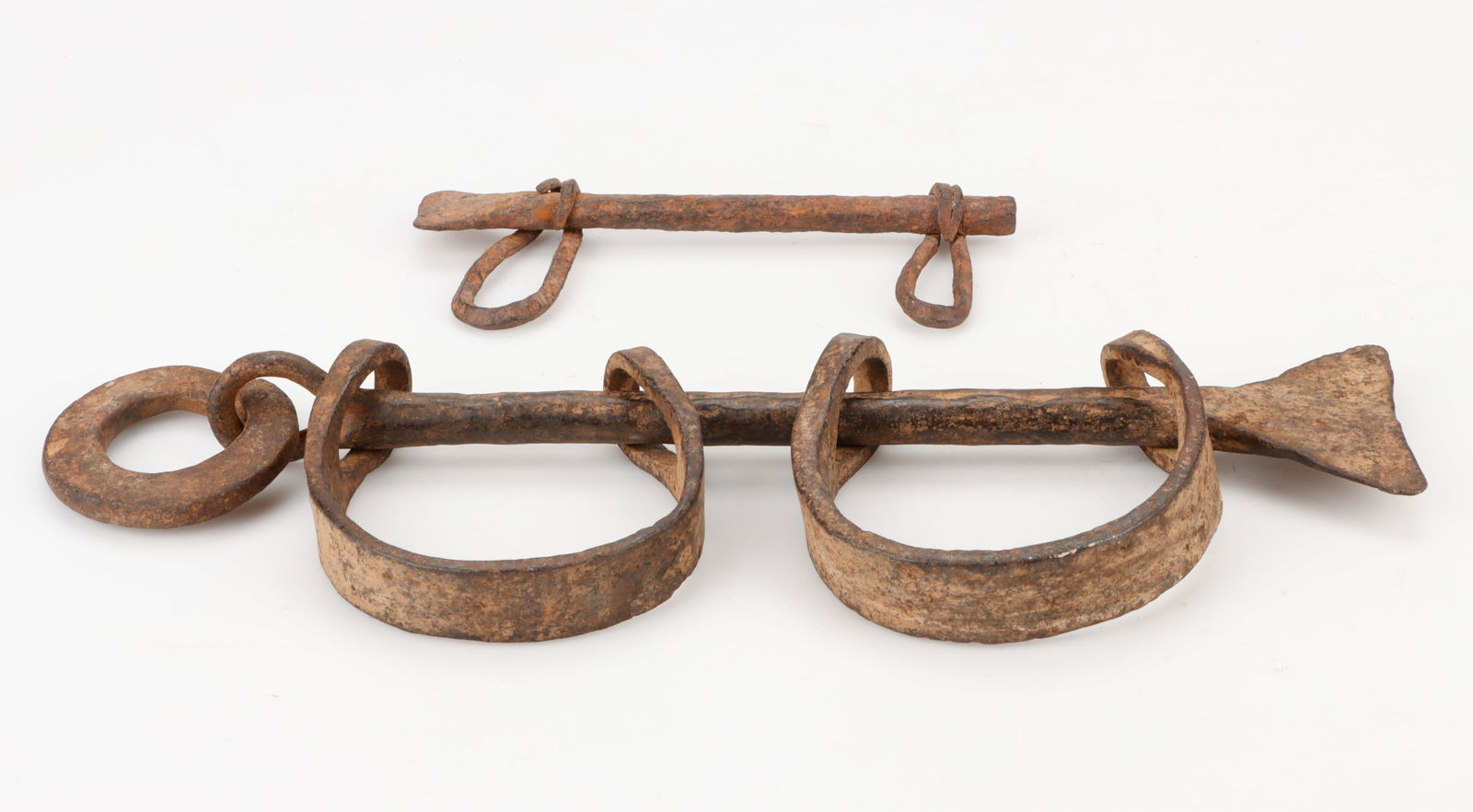 2 West African Antique Shackles, Burkina Faso: 2 West African Antique Shackles, Burkina Faso. Forged iron. Including: 1) Bwa Diminutive Talismanic Shackles, Length: 6" (15 cm); 2) slavery shackles, Length: 13" (33 cm). Provenance: Thomas G. B. Whe