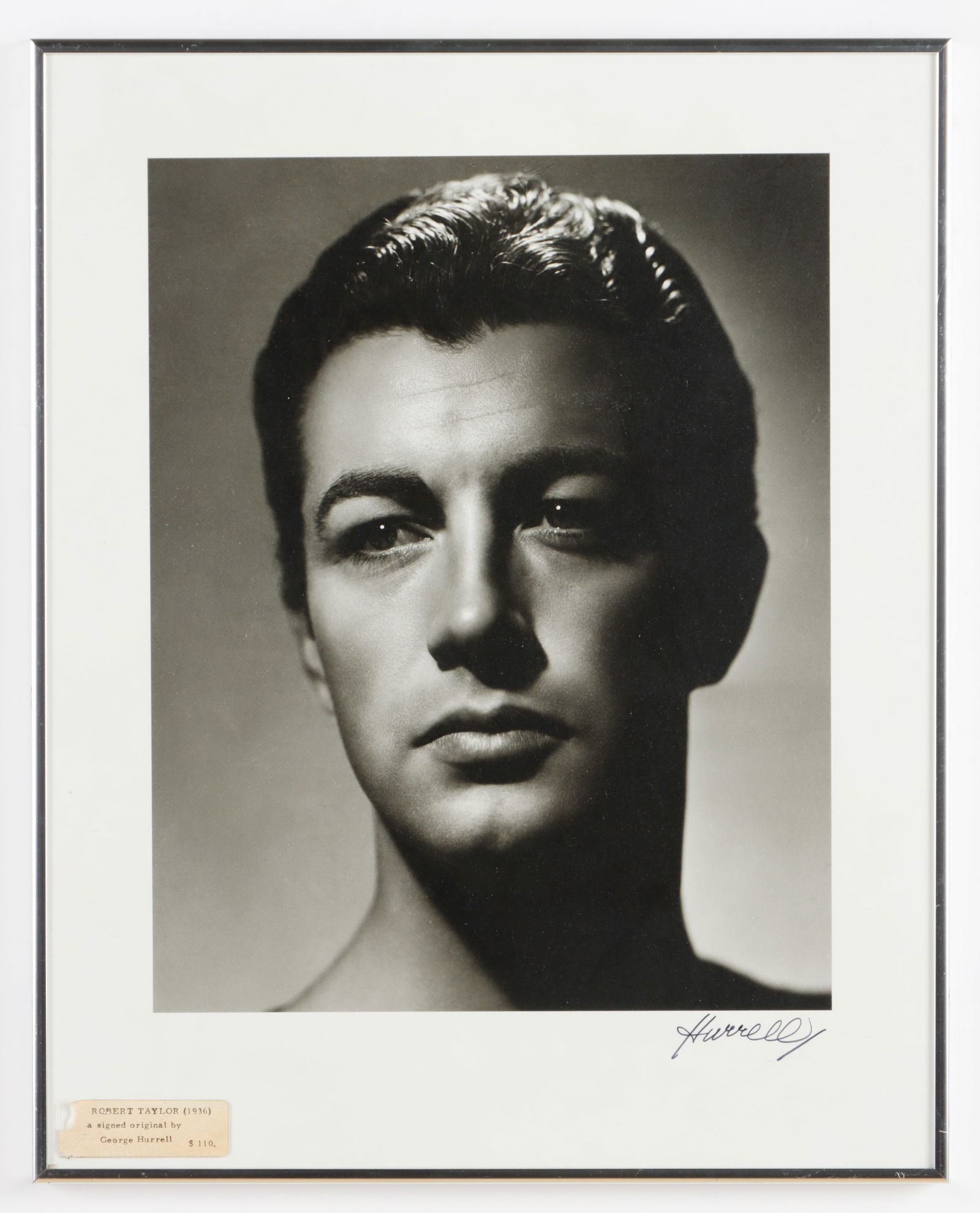 George Hurrell (1904-1992) Portrait of Robert Taylor, 1936: George Hurrell (American, 1904-1992) Portrait of Robert Taylor (1936), silver gelatin photograph, signed. Framed. Size: 15'' x 12'', 38 x 30 cm (image); 20.25'' x 16.25'', 51 x 41 cm (frame). Provenan