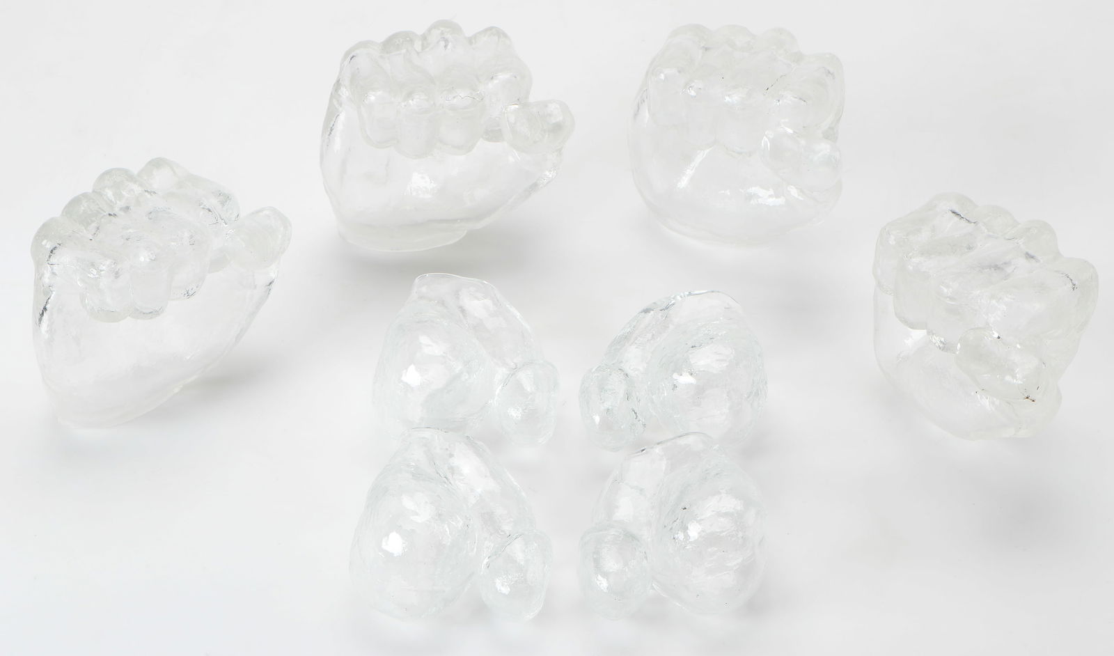 Robert Naess (American, B. 1943) 8 Glass Sculpture Elements: Robert Naess (American, B. 1943) 8 Glass Sculpture Elements (4 Fists, 4 Male Genitalia). Length: 3.5" (9 cm) to 4" (10 cm). Provenance: The Robert L. Pfannebecker Collection.