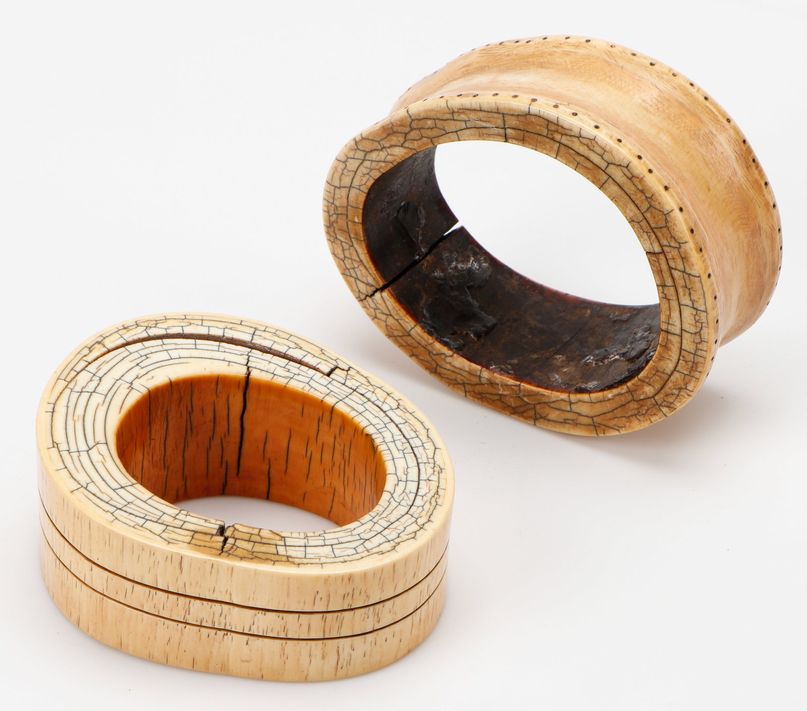 2 Antique African Bone Bracelets: 2 Antique African Bone Bracelets. Each Size: 2'' x 5.5'' x 4'' (5 x 14 x 10 cm).