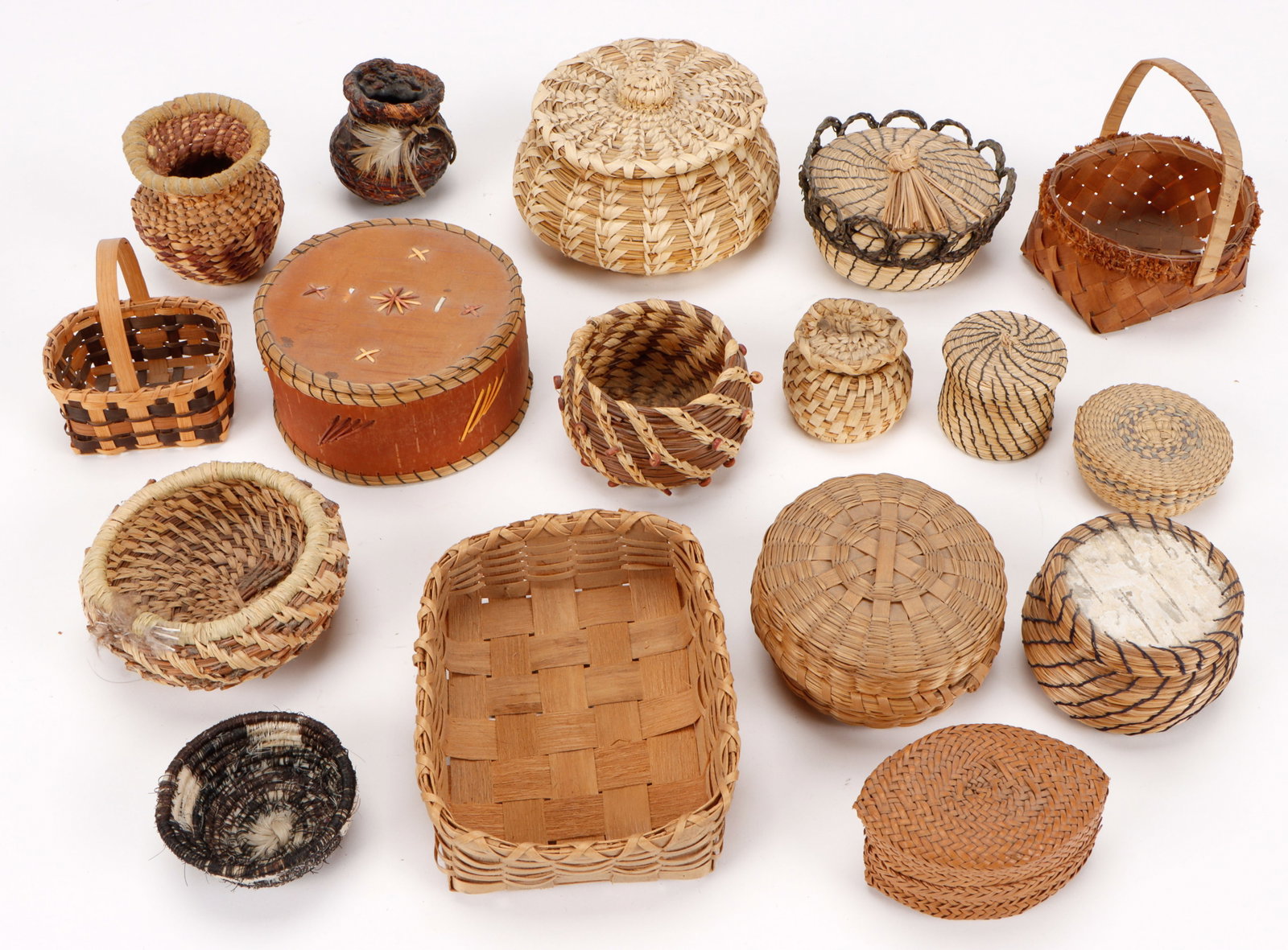 Collector's Lot of 17 Native Baskets: Collector's Lot of 17 Native Baskets. Size: ranging from 1'' x 2.75'' x 2.75'' (3 x 7 x 7 cm) to 1'' x 2.75'' (3 x 7 cm).