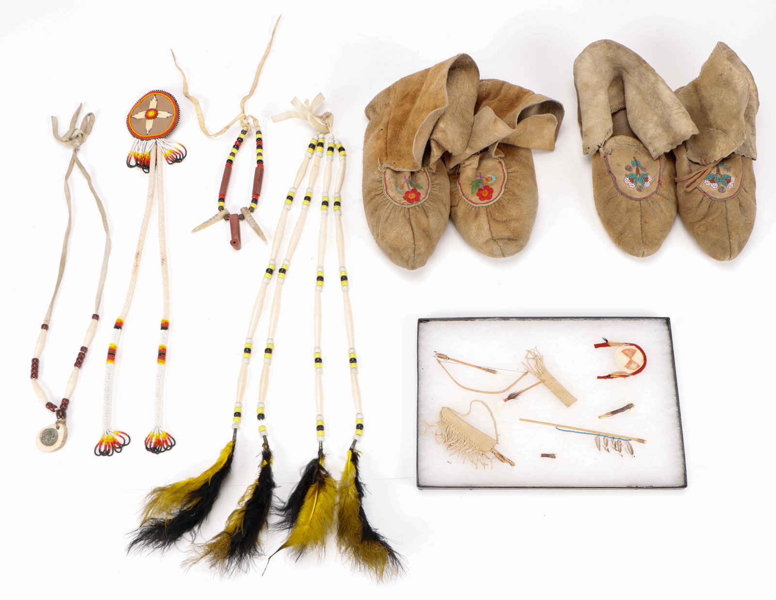 Collector's Lot of 10 Native American Items: Collector's Lot of 10 Native American Items. Including: Indian Head Nickel Necklace, artist unknown, Nickel, Bone, Rawhide, Beads, Chain; Pipestone Choker, unknown artist, pipestone, bone, hide, beads