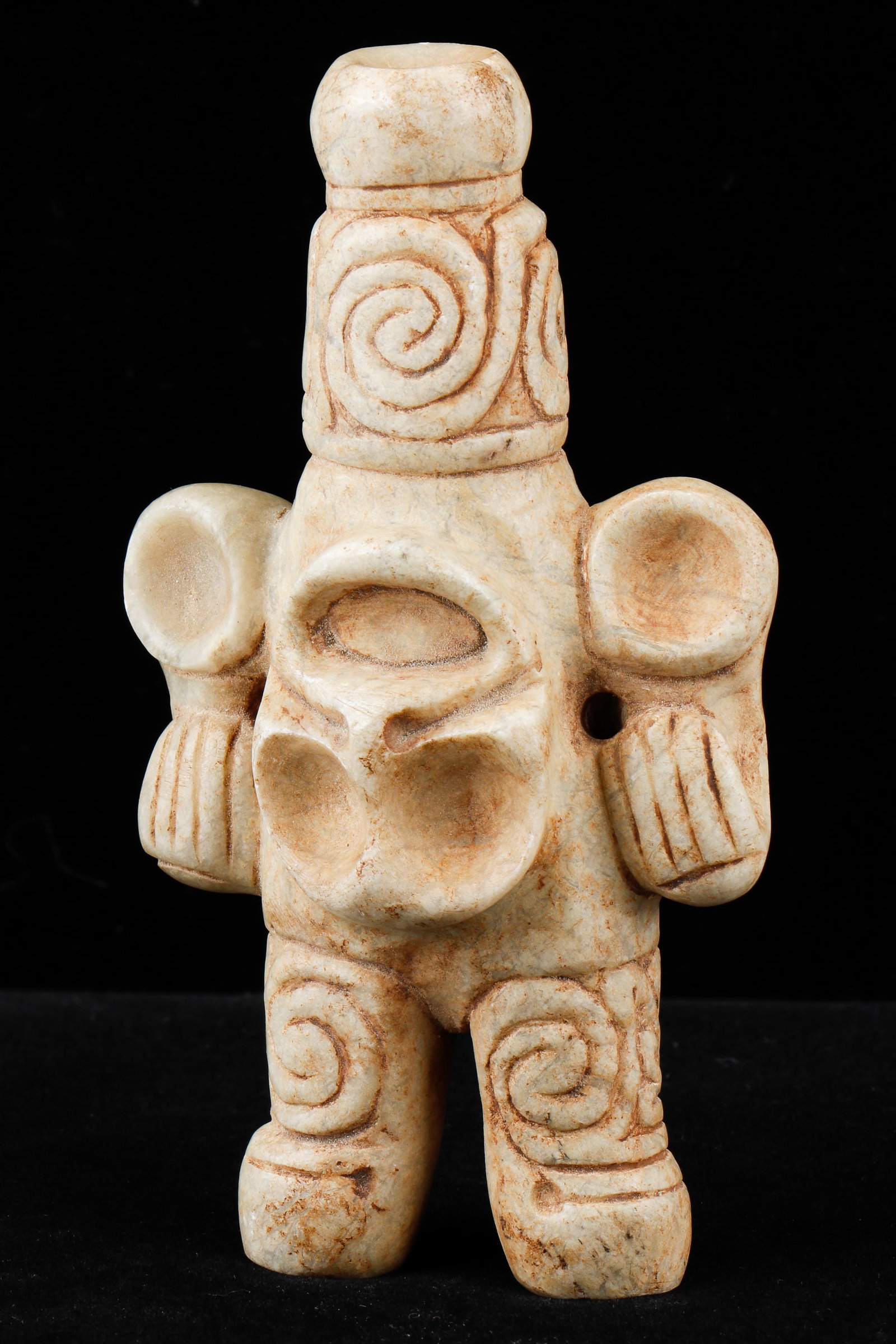 Taino Type 1 Cohoba Snuffer: Taino Type 1 Cohoba Snuffer. Used to inhale the hallucinogenic ground seeds of the cohobana tree (Anadenanthera). A Pleasant face is carved on the front. Hands form part of ear ornaments. Ports are ni