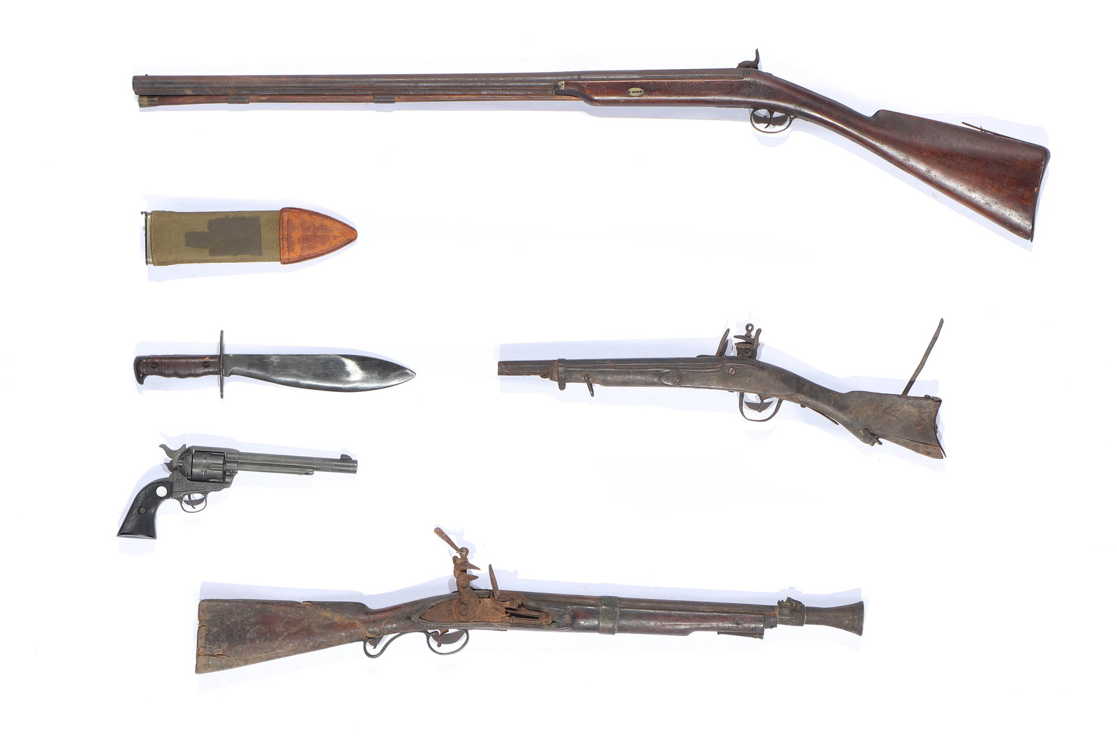 Group of Antique Flintklock Guns, a Knife and prop revolver: Group of 3 Antique Flintklock Guns and a Knife, together with a prop revolver. Sizes Ranging From: 6'' x 13'' x 1.75'' (15 x 33 x 4 cm); To: 48.25'' x 4.5'' x 1.75'' (123 x 11 x 4 cm).